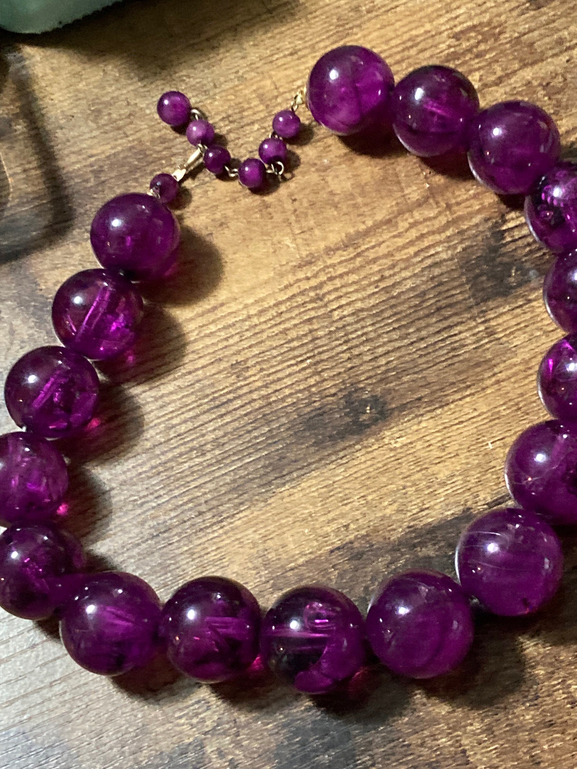 Oversized plastic beaded necklace purple tones