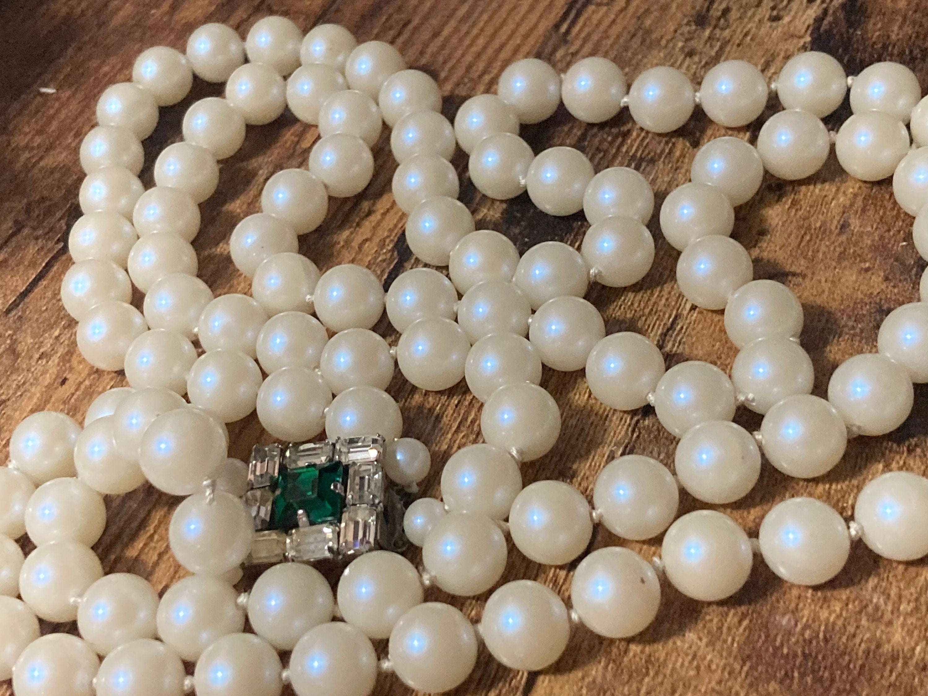 Vintage white faux pearl double strand necklace with emerald paste clasp