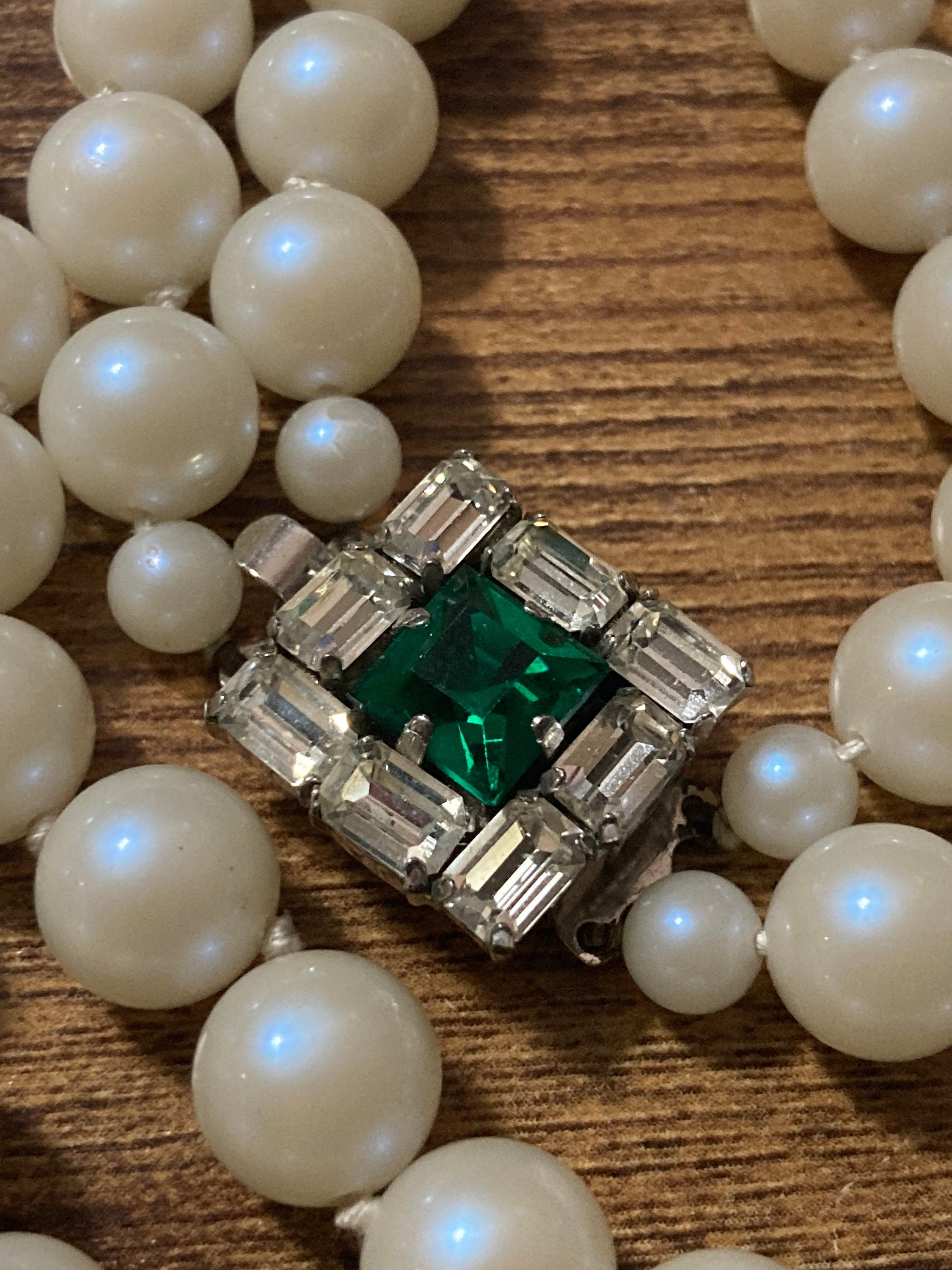 Vintage white faux pearl double strand necklace with emerald paste clasp