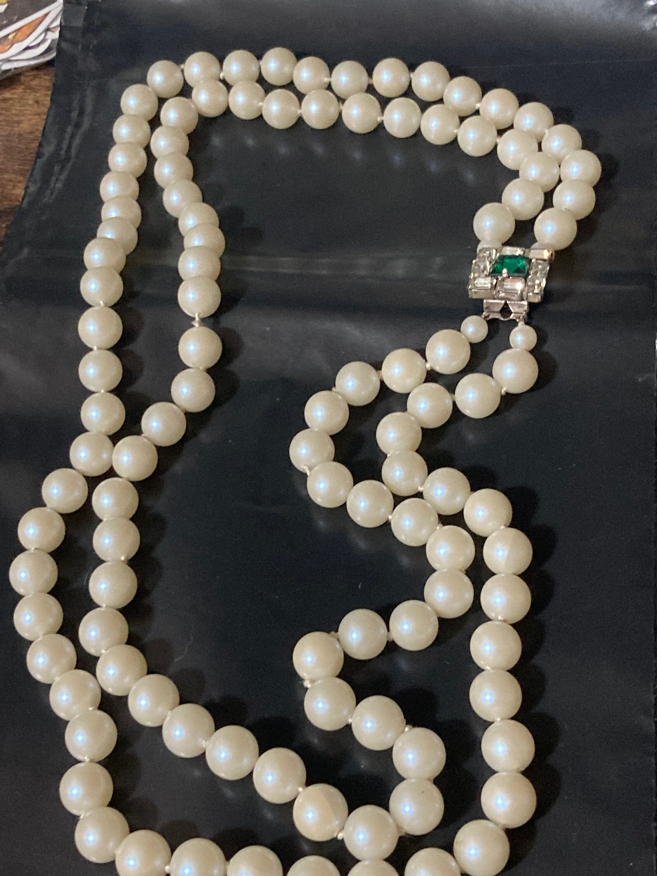 Vintage white faux pearl double strand necklace with emerald paste clasp