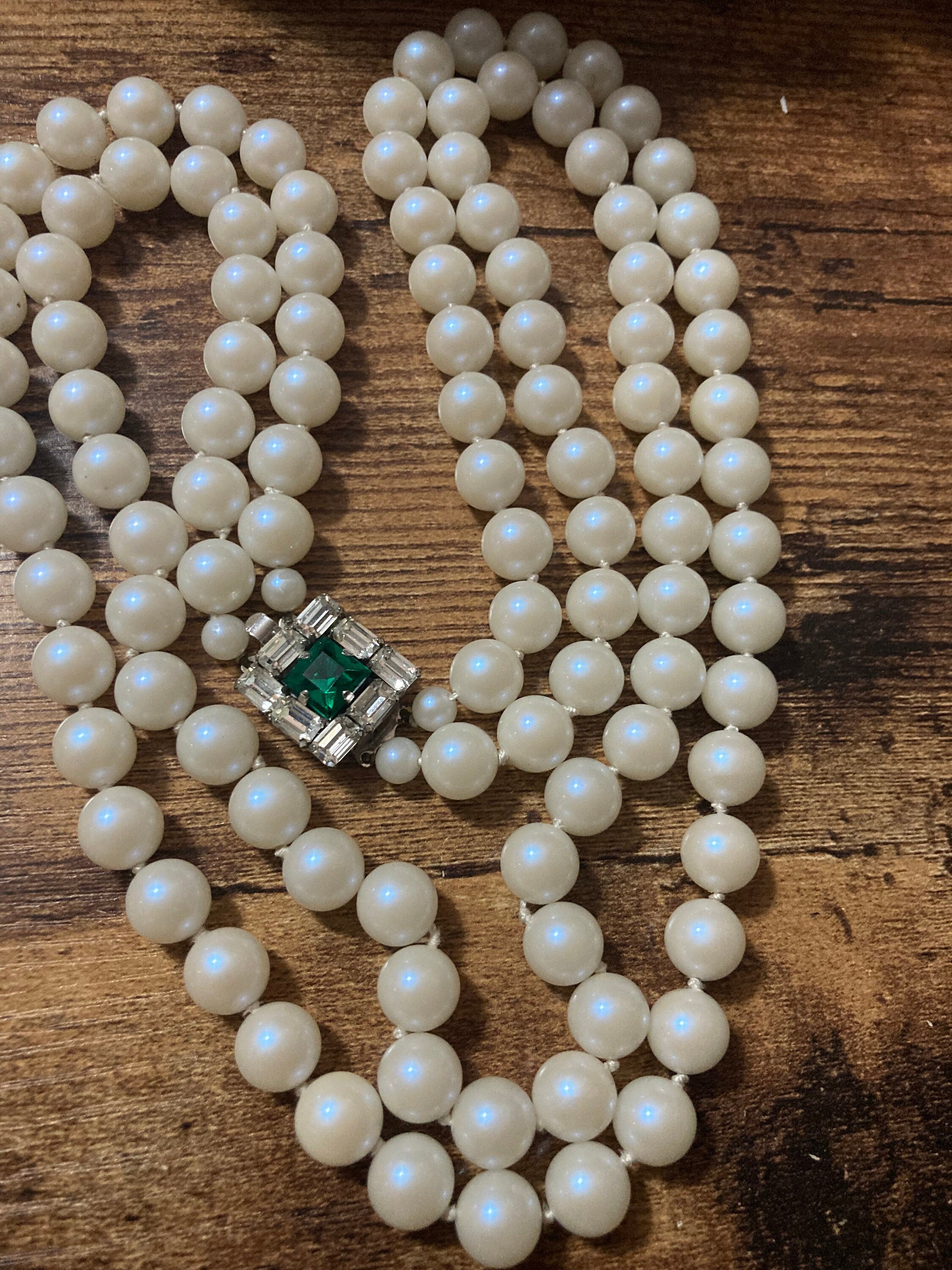 Vintage white faux pearl double strand necklace with emerald paste clasp