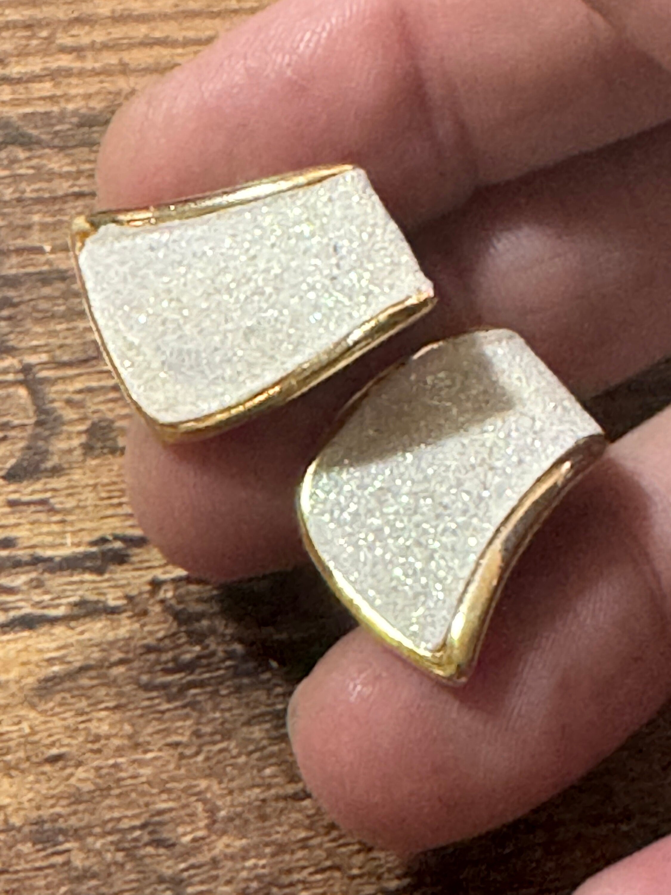 Vintage 1980s gold tone abstract white glitter clip on earrings