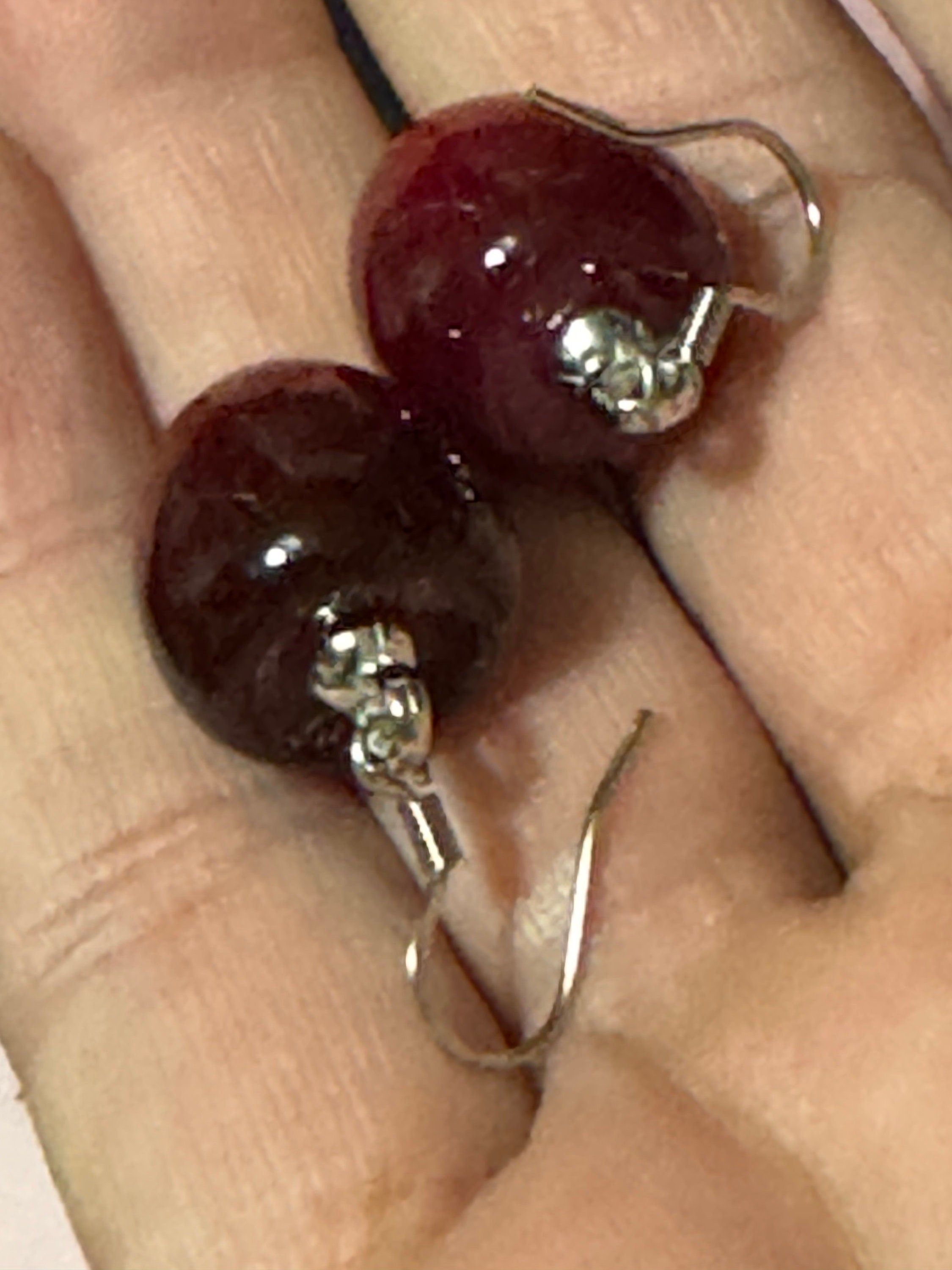 pair of silver tone dark red cherry drop earrings pierced ears