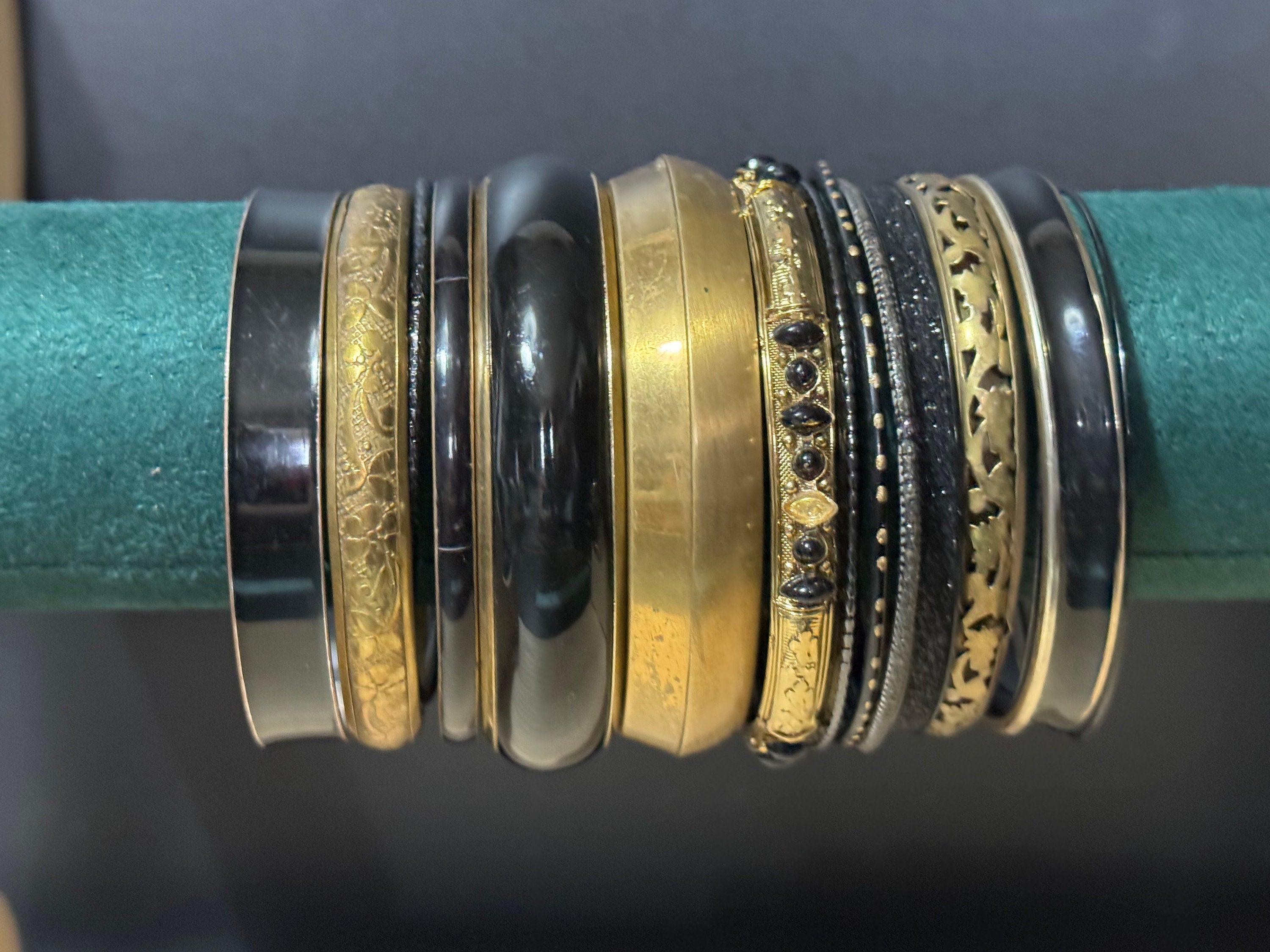 Armful of vintage black and gold tones slim and wide tacking boho bangles
