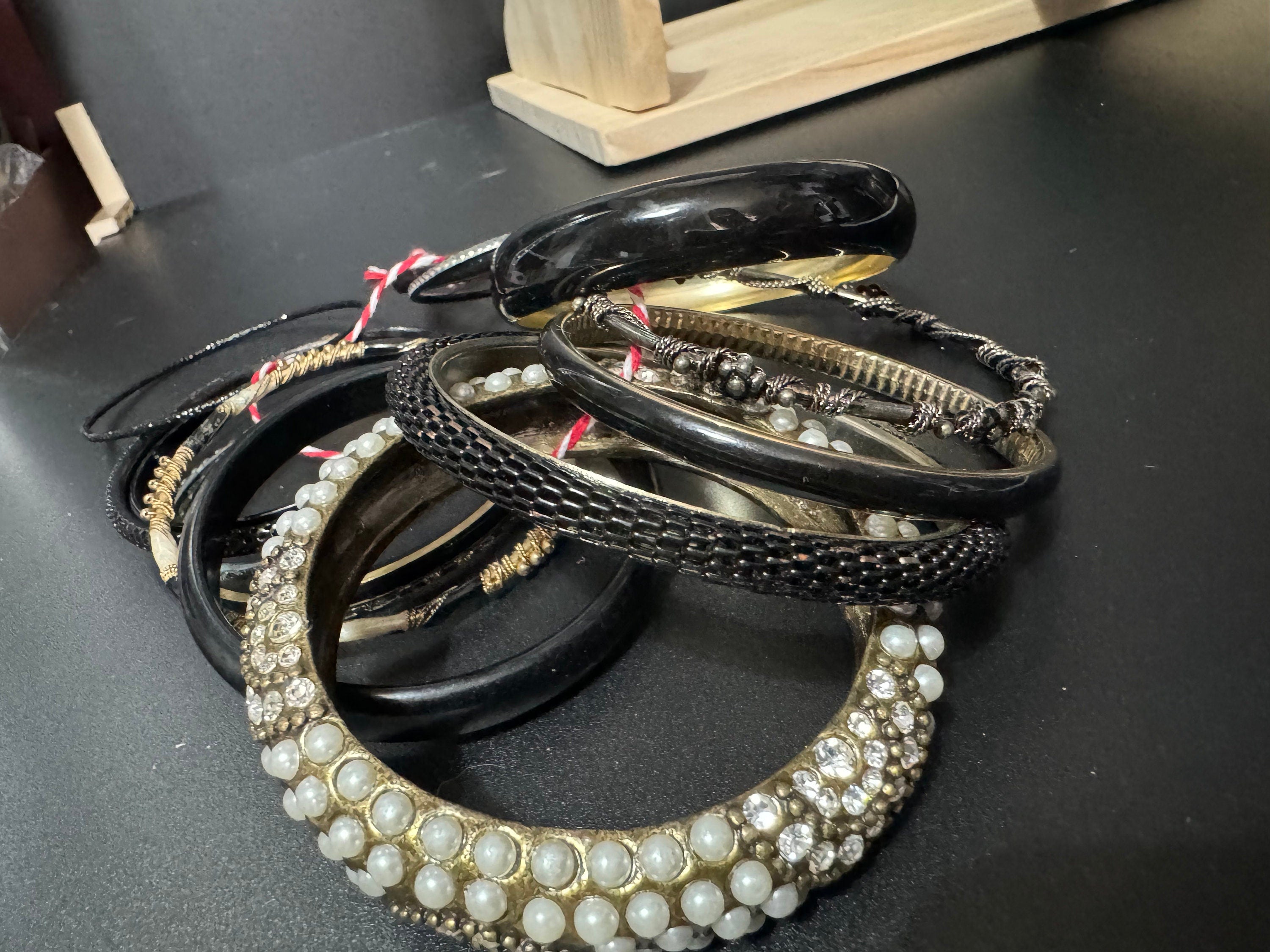 Armful of vintage black and gold tones slim and wide tacking boho bangles