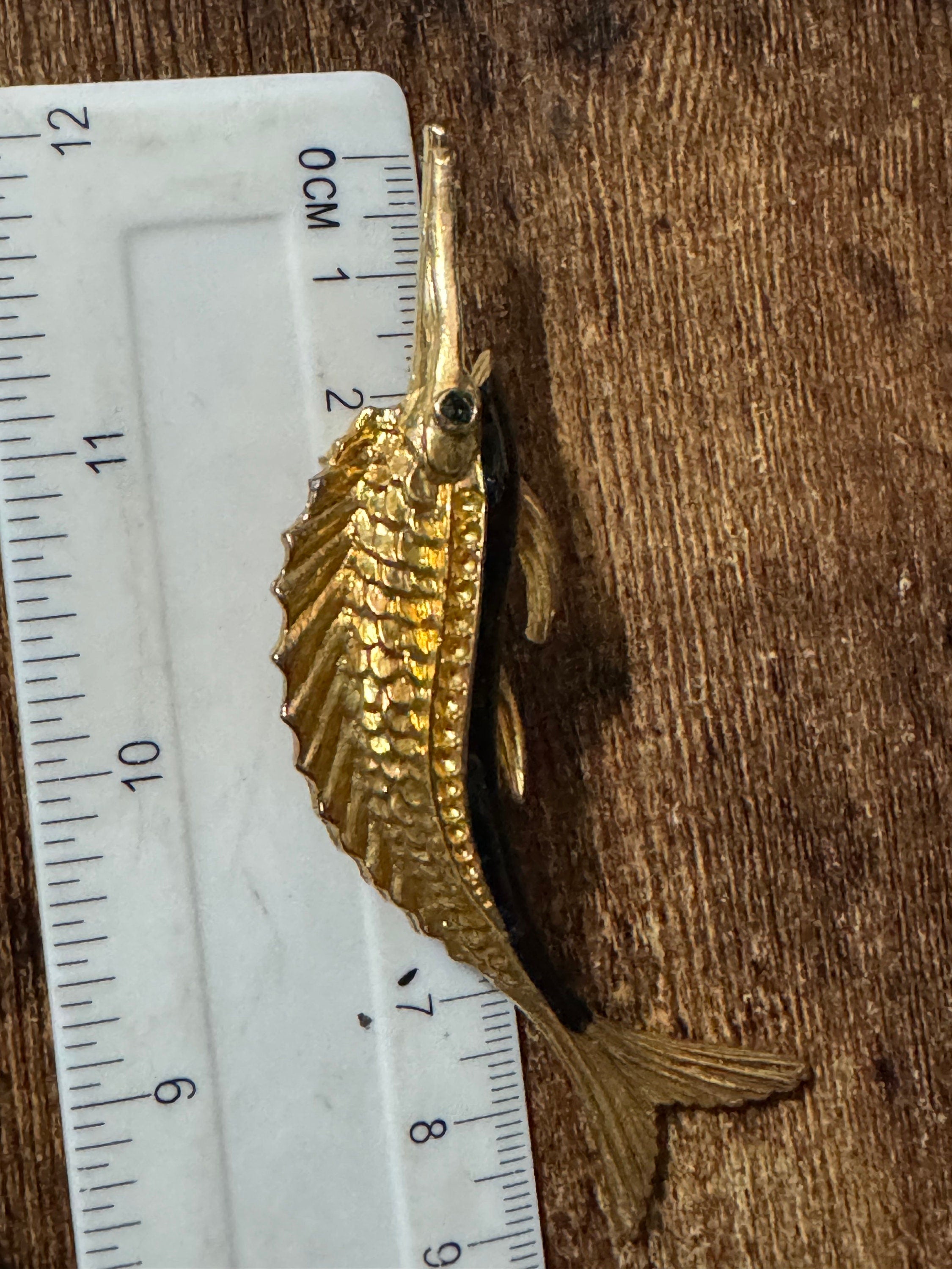 Vintage 1980s Gold Tone Marlin Brooch: Black Enamel, Emerald Green Eyes