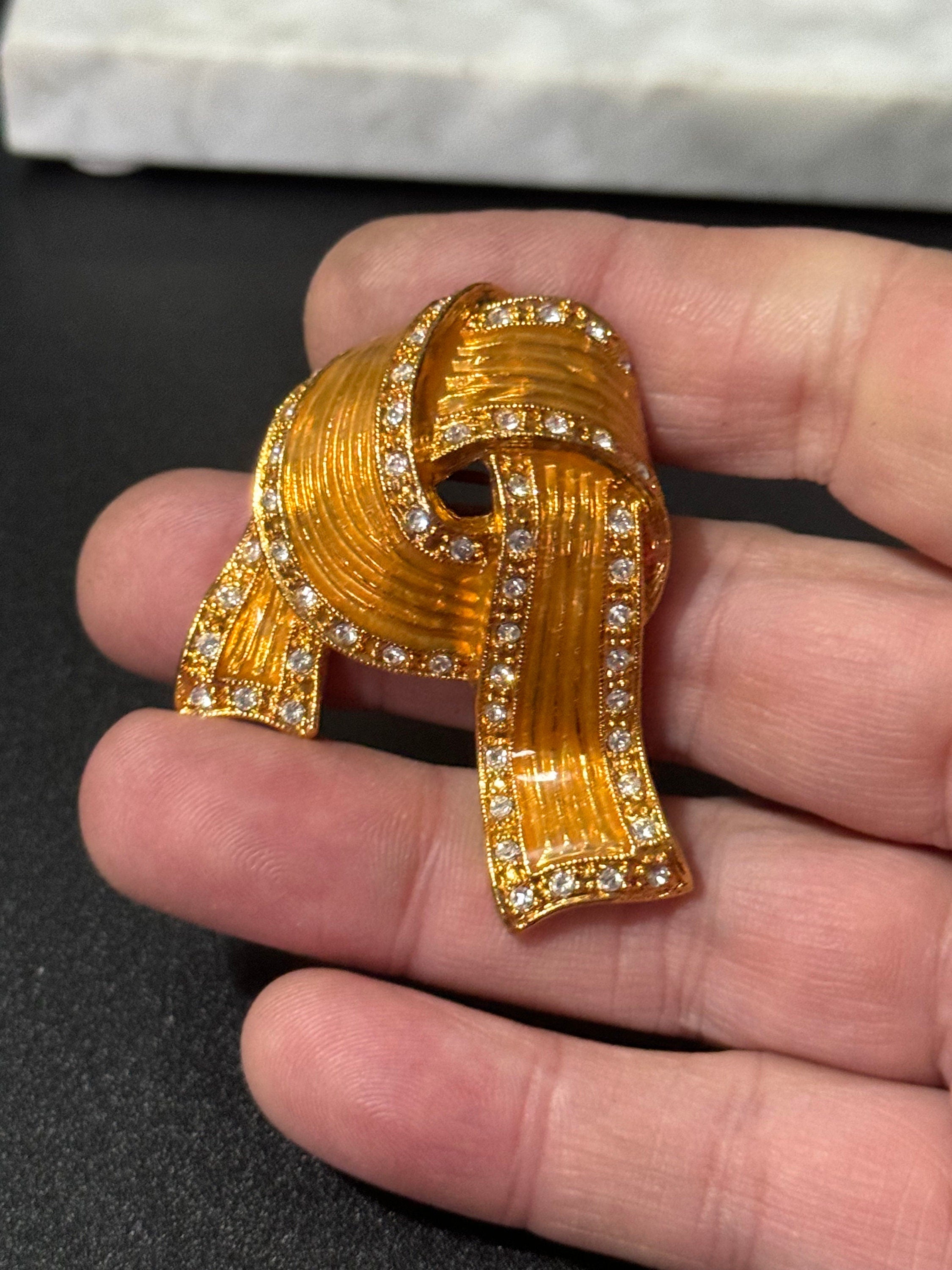 Signed JBK Camrose & Kross Jacqueline Kennedy gold tone diamanté ribbon JBK brooch 1980s