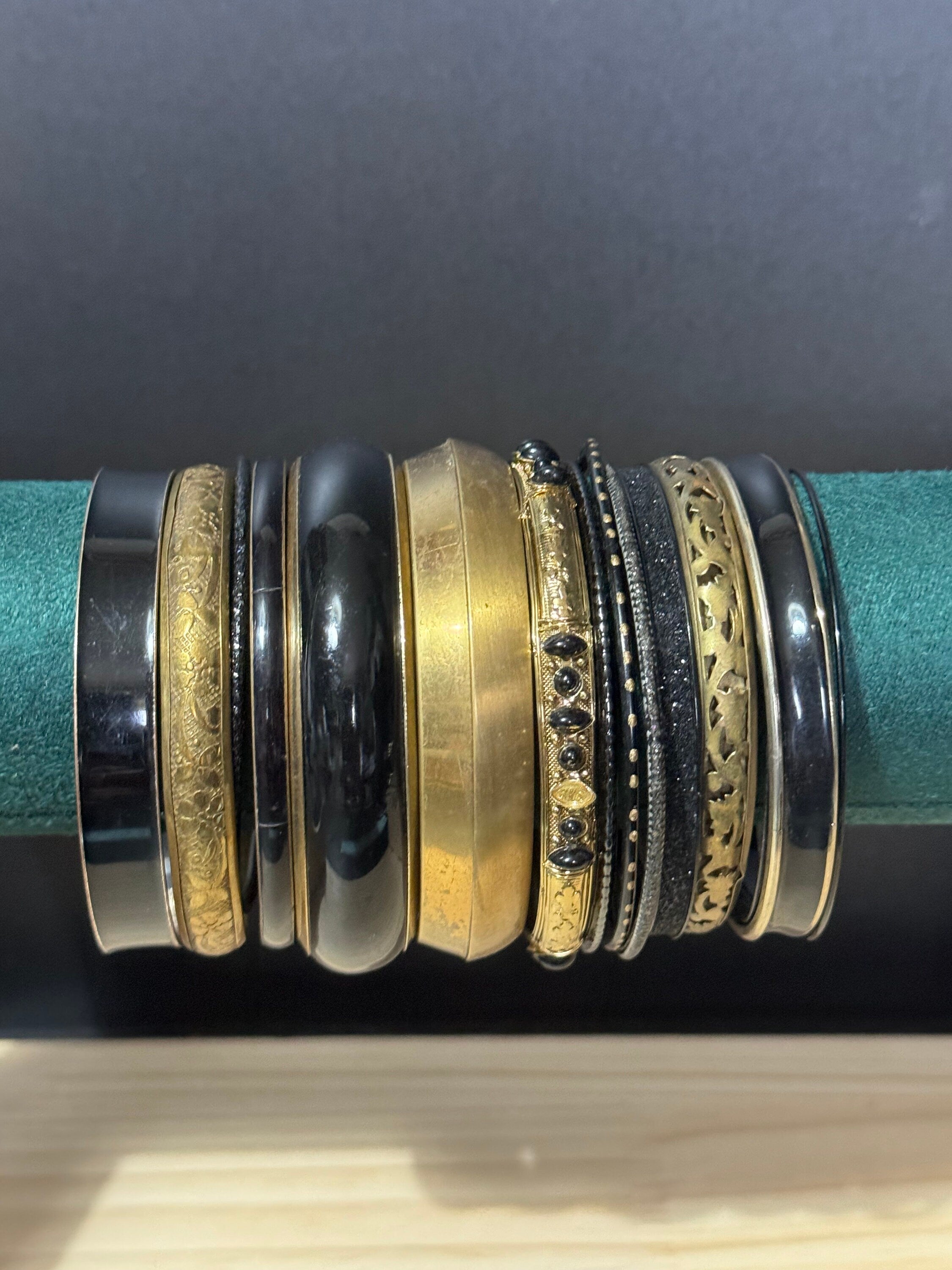 Armful of vintage black and gold tones slim and wide tacking boho bangles