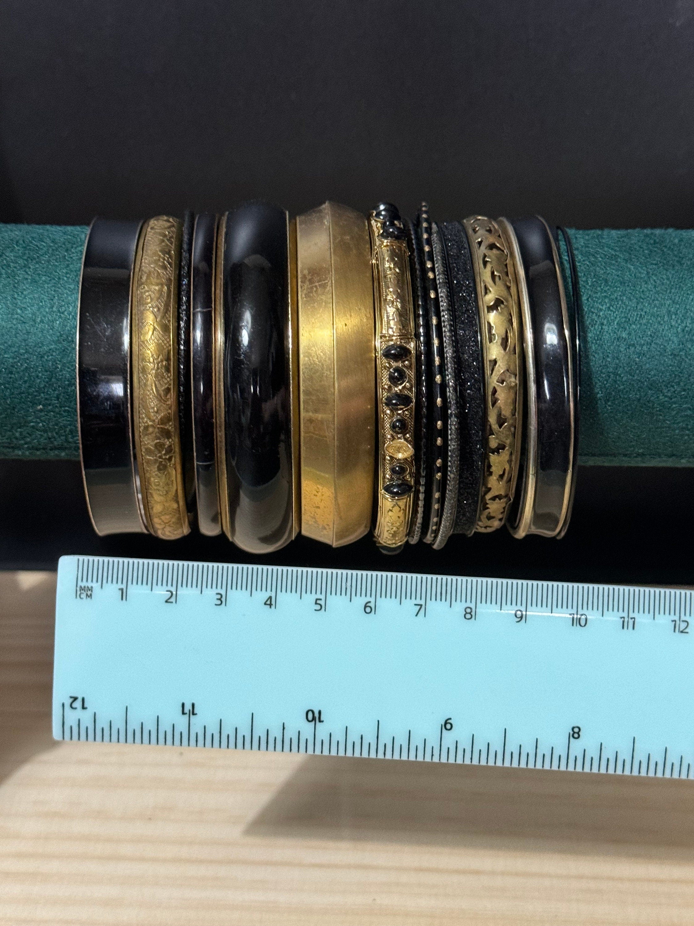 Armful of vintage black and gold tones slim and wide tacking boho bangles