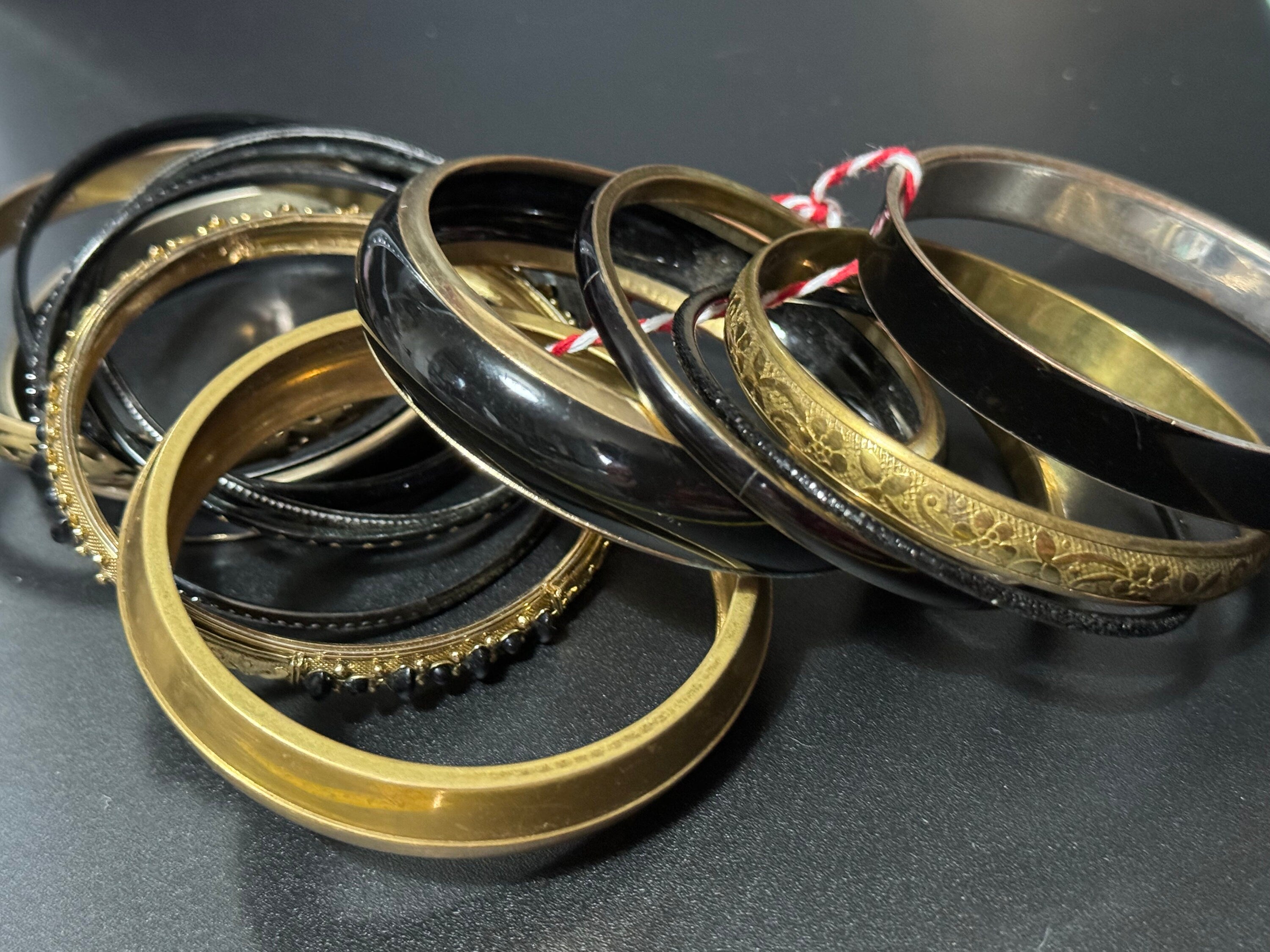 Armful of vintage black and gold tones slim and wide tacking boho bangles