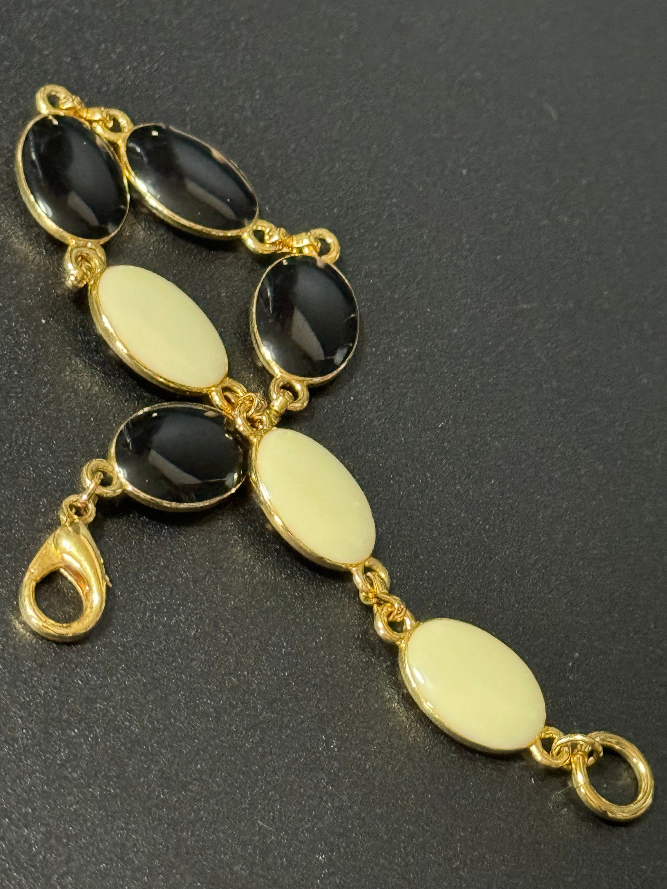 Vintage gold tone black and cream oval enamel panel link bracelet