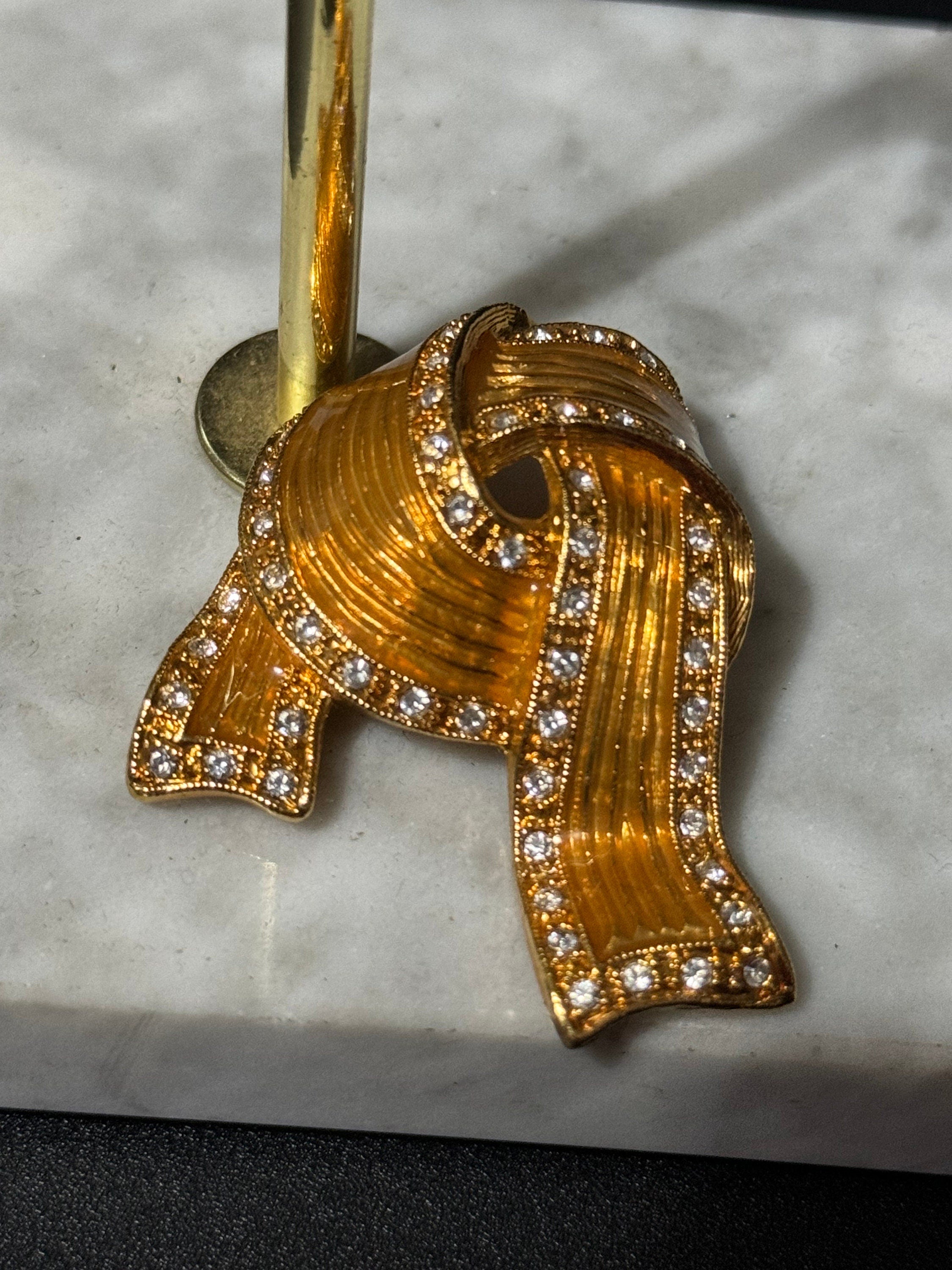Signed JBK Camrose & Kross Jacqueline Kennedy gold tone diamanté ribbon JBK brooch 1980s