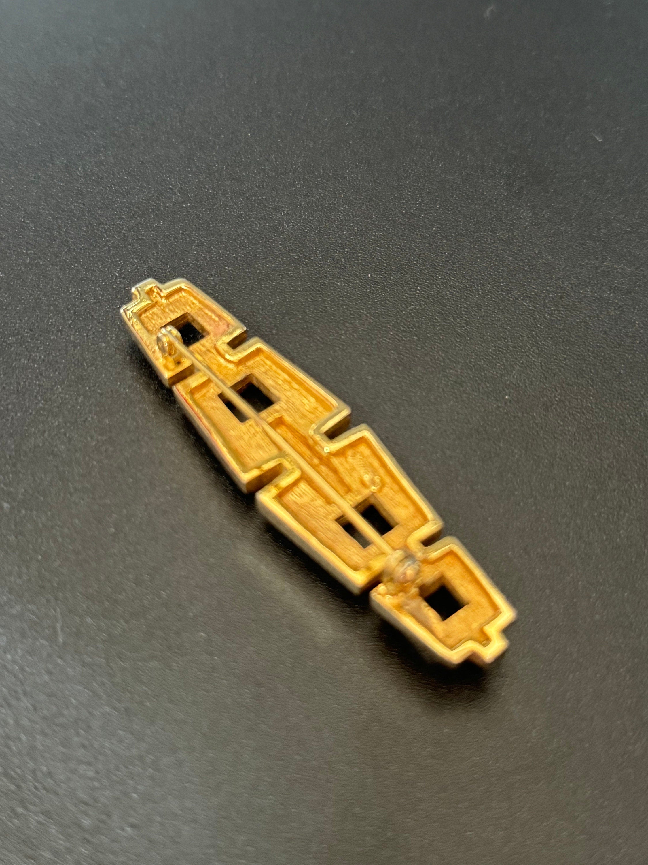 Signed GROSSE German Designer rhinestone Gold Tone modernist high end bar brooch with roll clasp