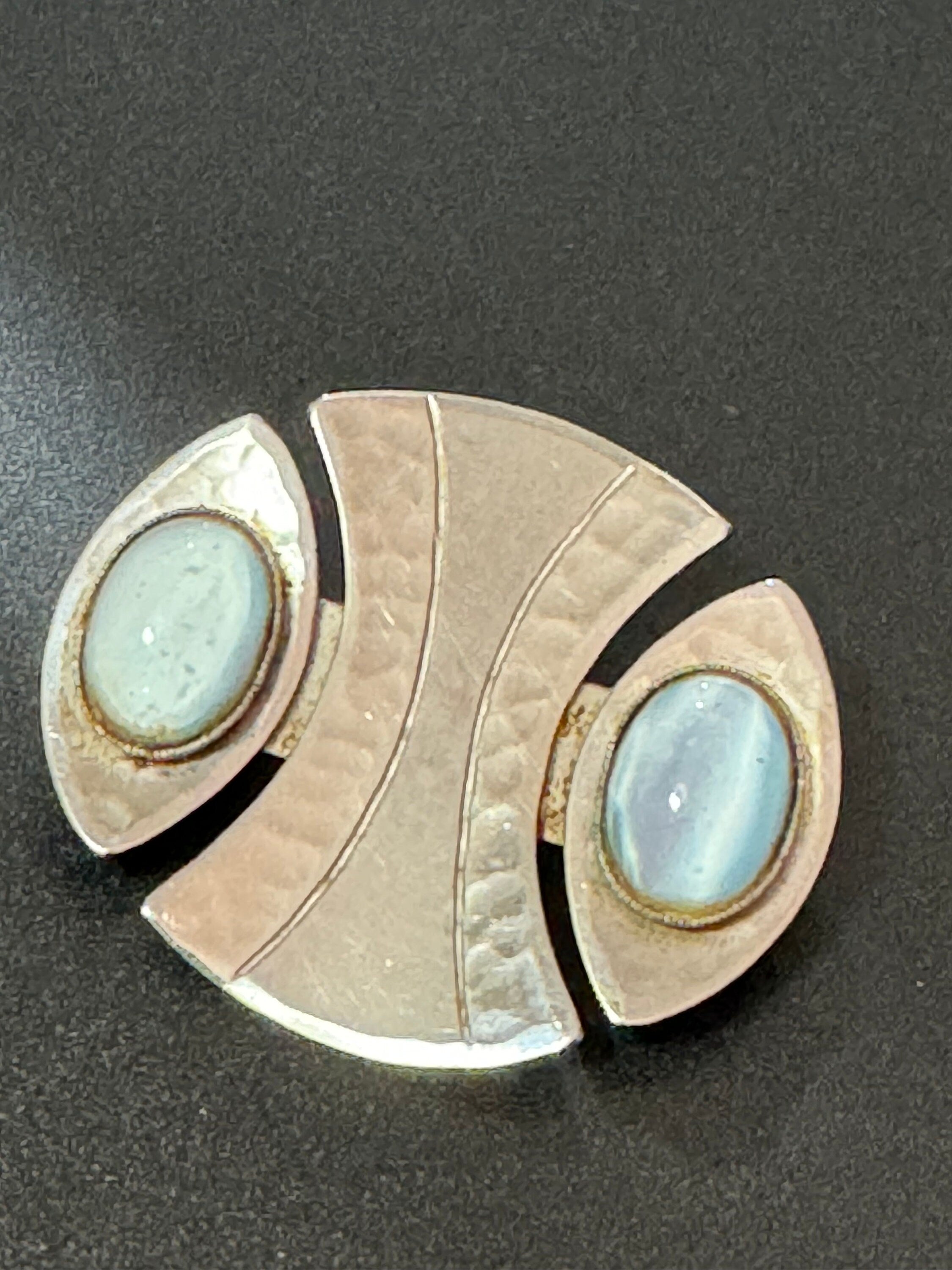 Signed MODA Malta Modernist silver tone stainless steel brooch with blue grey oval cabochons