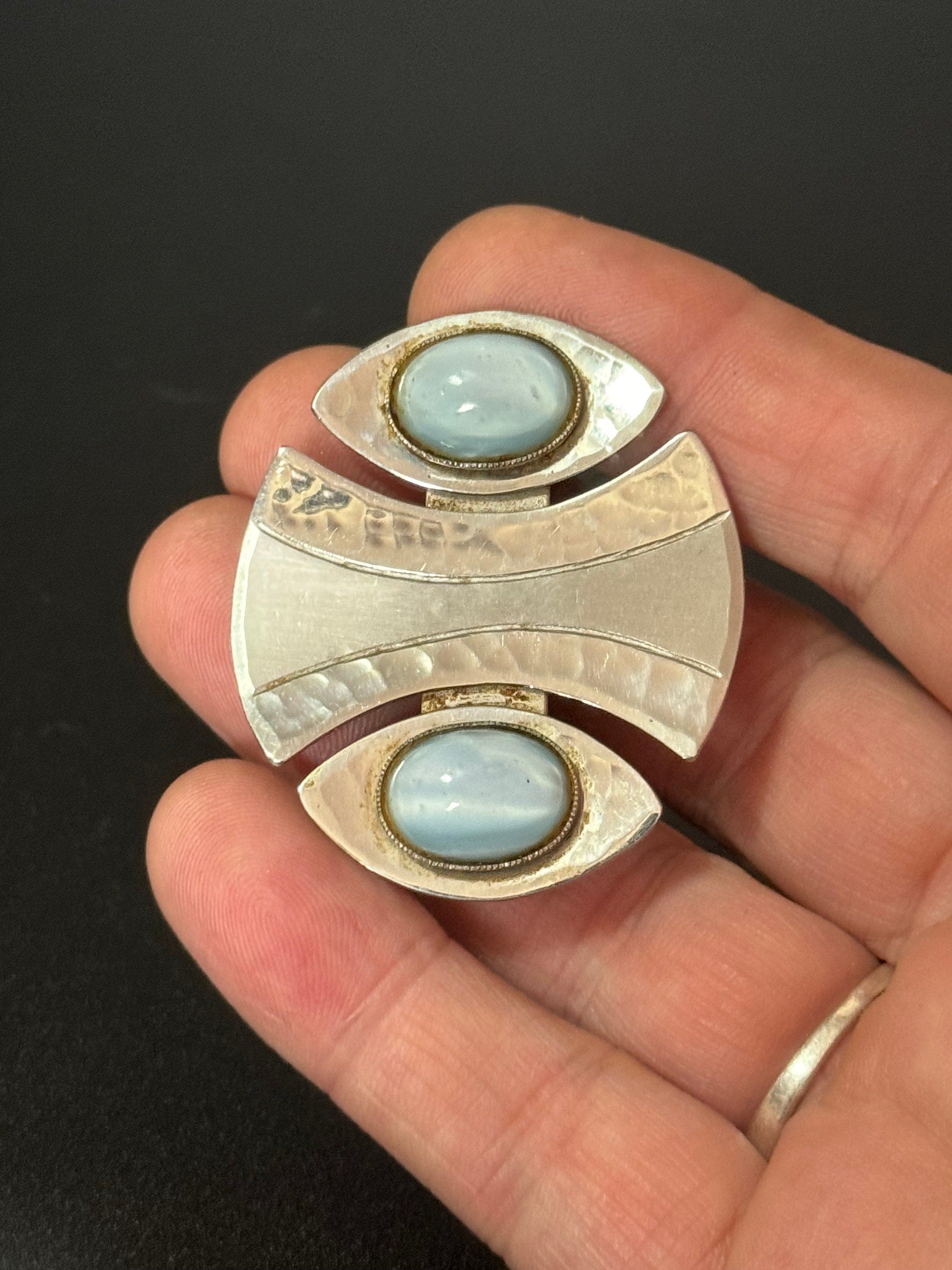 Signed MODA Malta Modernist silver tone stainless steel brooch with blue grey oval cabochons