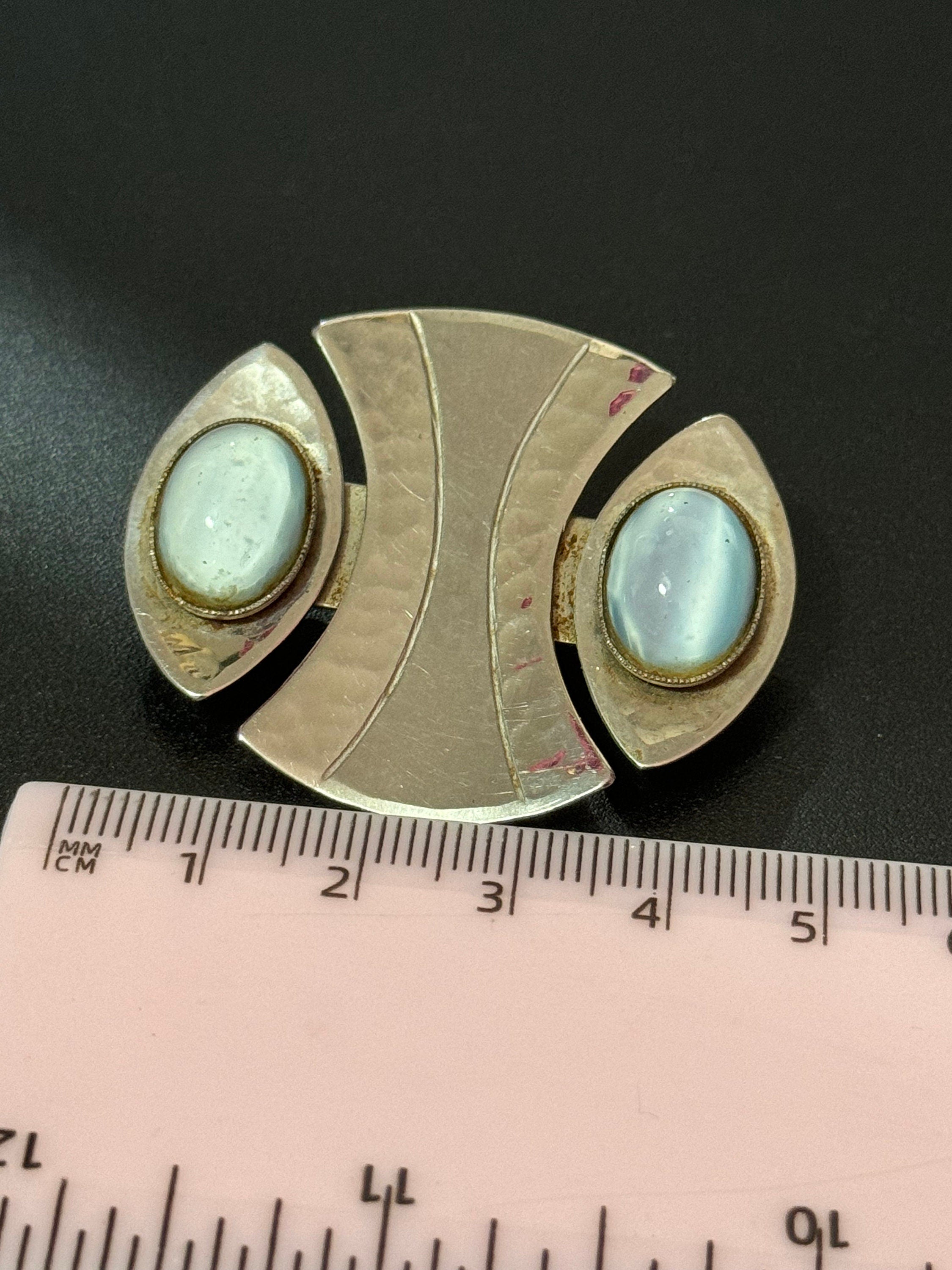 Signed MODA Malta Modernist silver tone stainless steel brooch with blue grey oval cabochons
