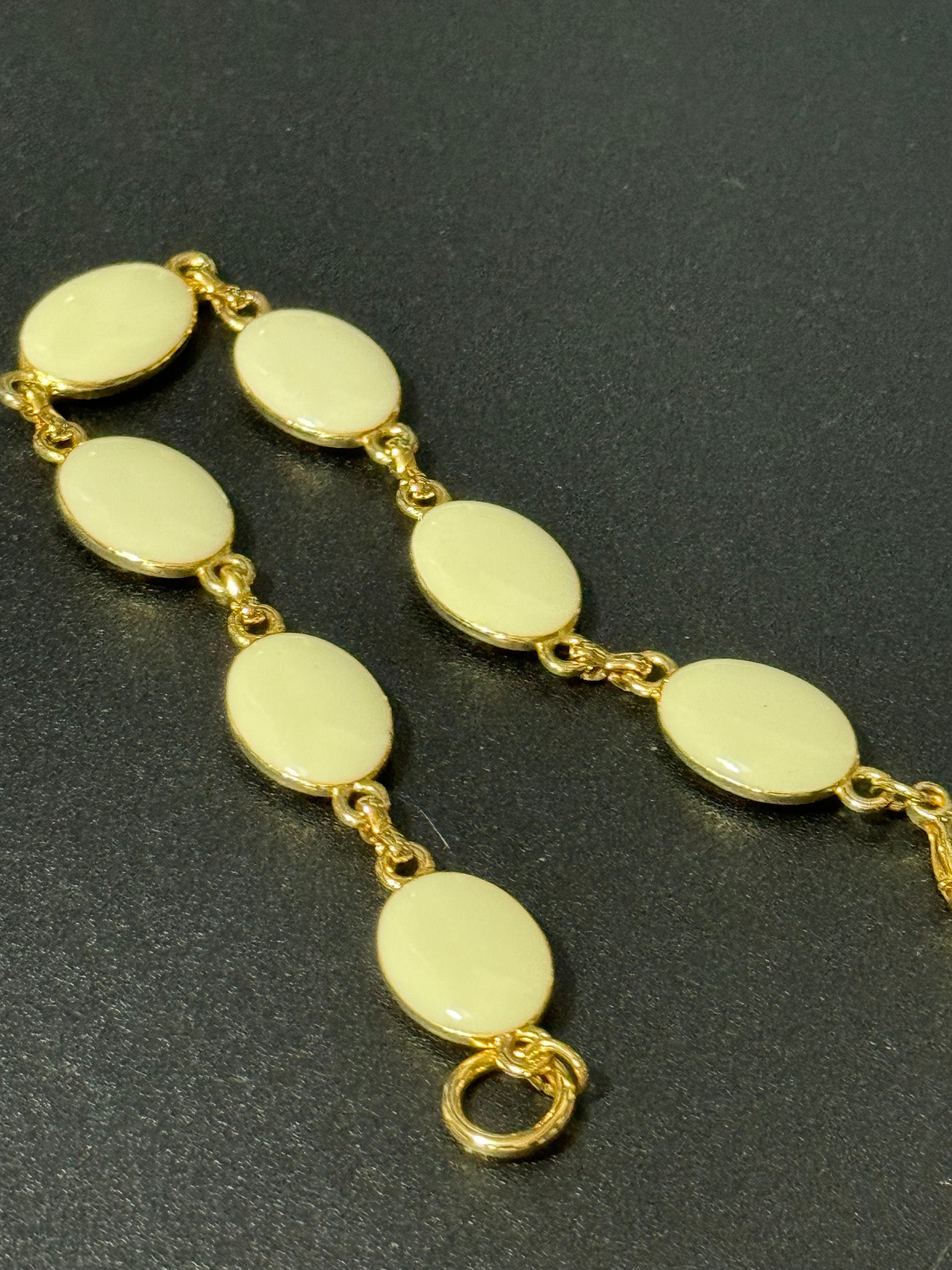 Vintage gold tone black and cream oval enamel panel link bracelet