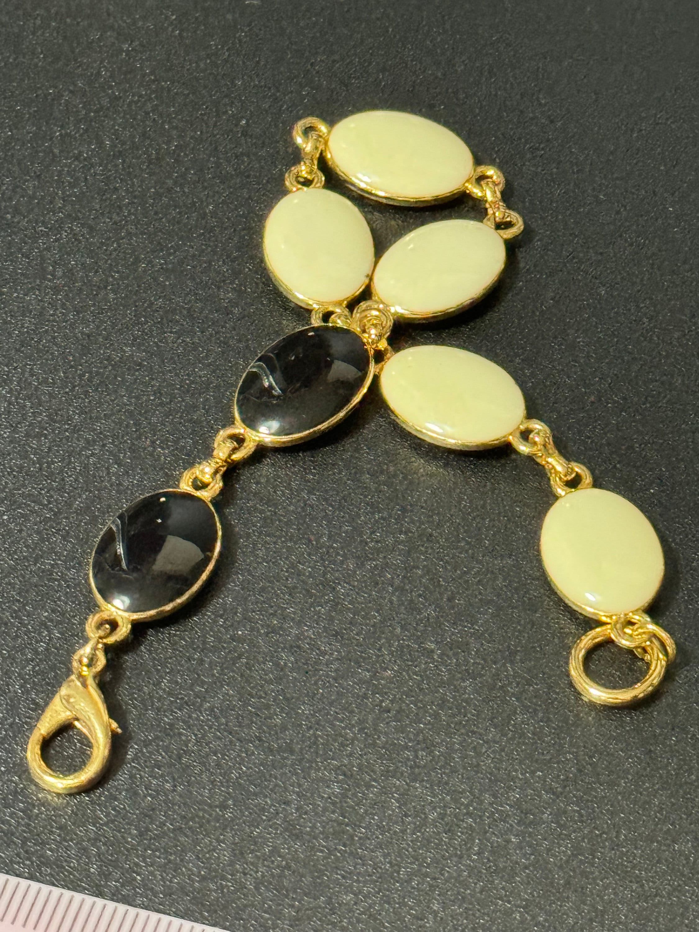 Vintage gold tone black and cream oval enamel panel link bracelet