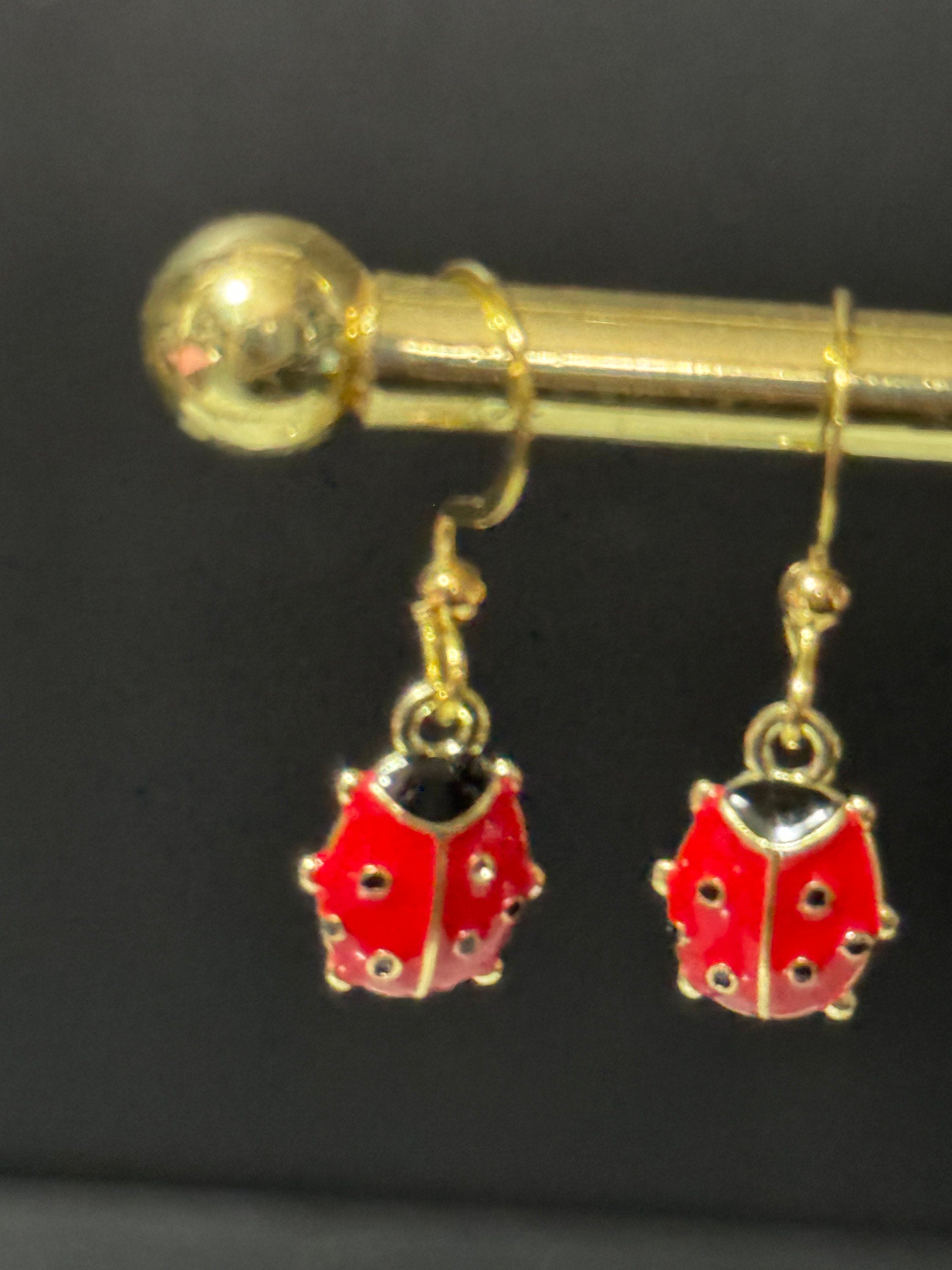 Gold tone black and red enamel ladybird drop earrings for girls