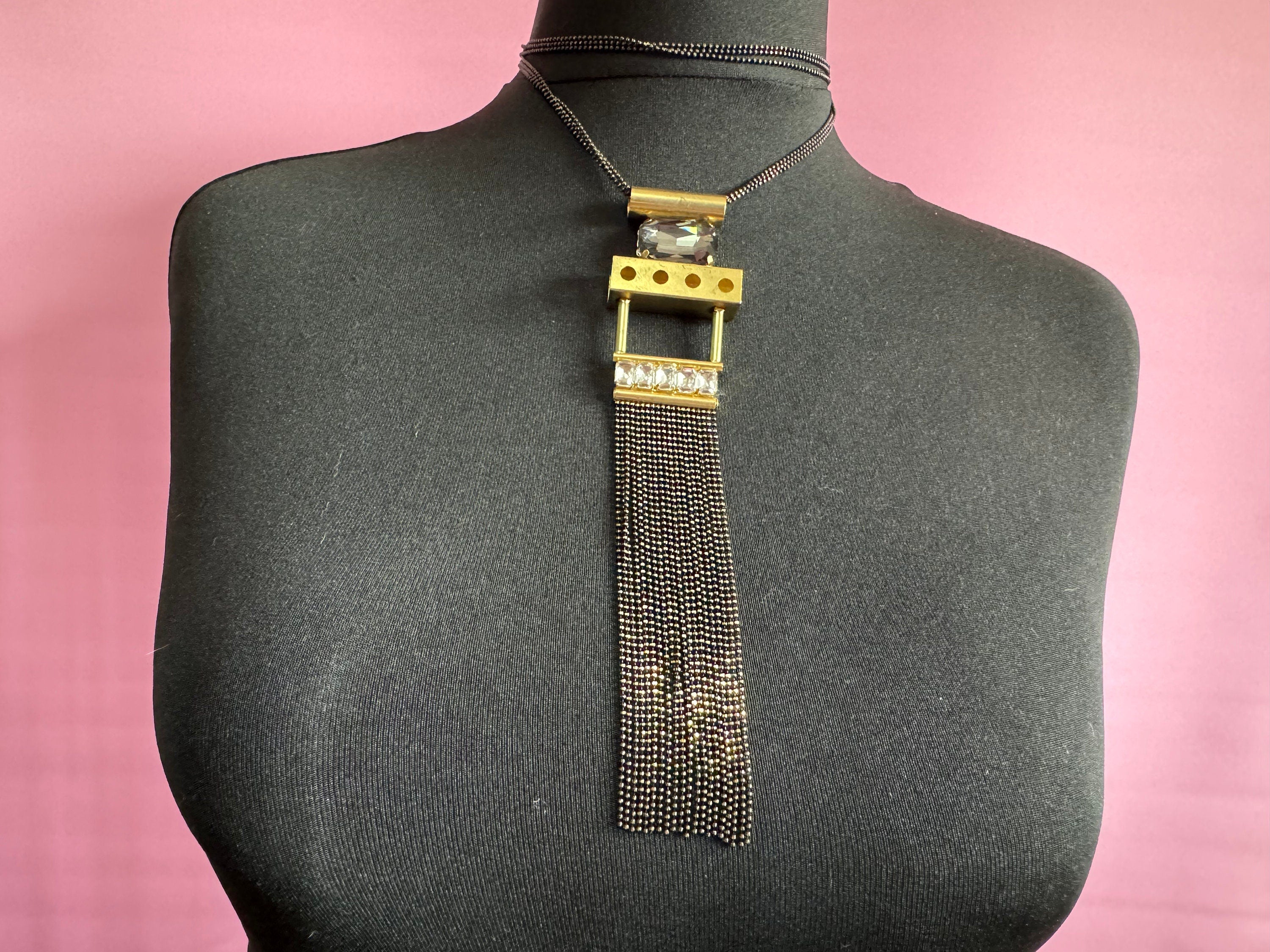 Signed Karine Sultan designer black and gold long medallion pendant tassel drop necklace couture