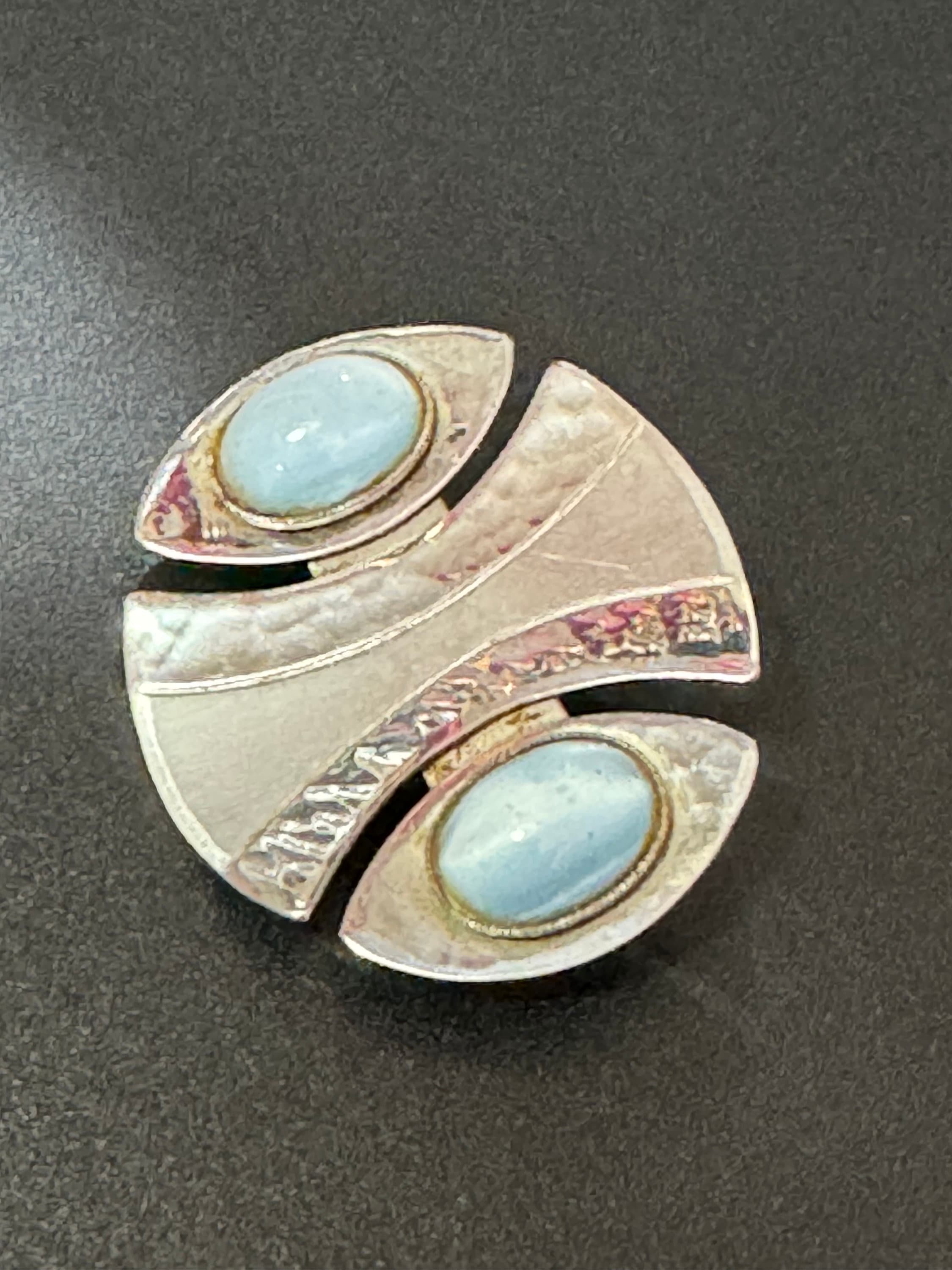 Signed MODA Malta Modernist silver tone stainless steel brooch with blue grey oval cabochons