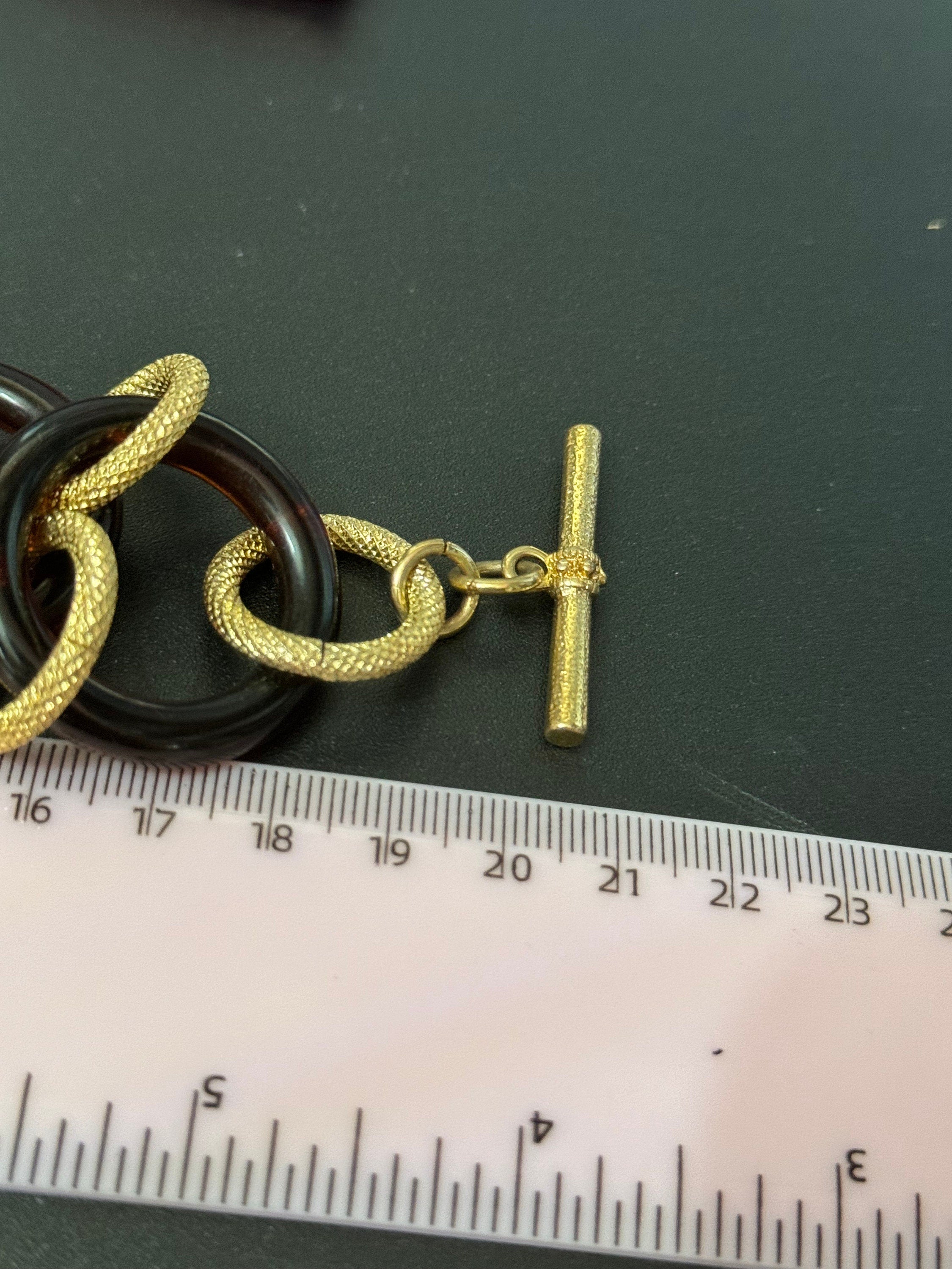 Signed KJL gold tone and faux tortoiseshell plastic link chunky wide curb link chain bracelet toggle closure