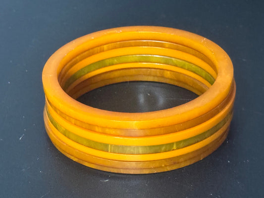3cm stack of vintage retro orange tones early plastic bangles 7 pieces