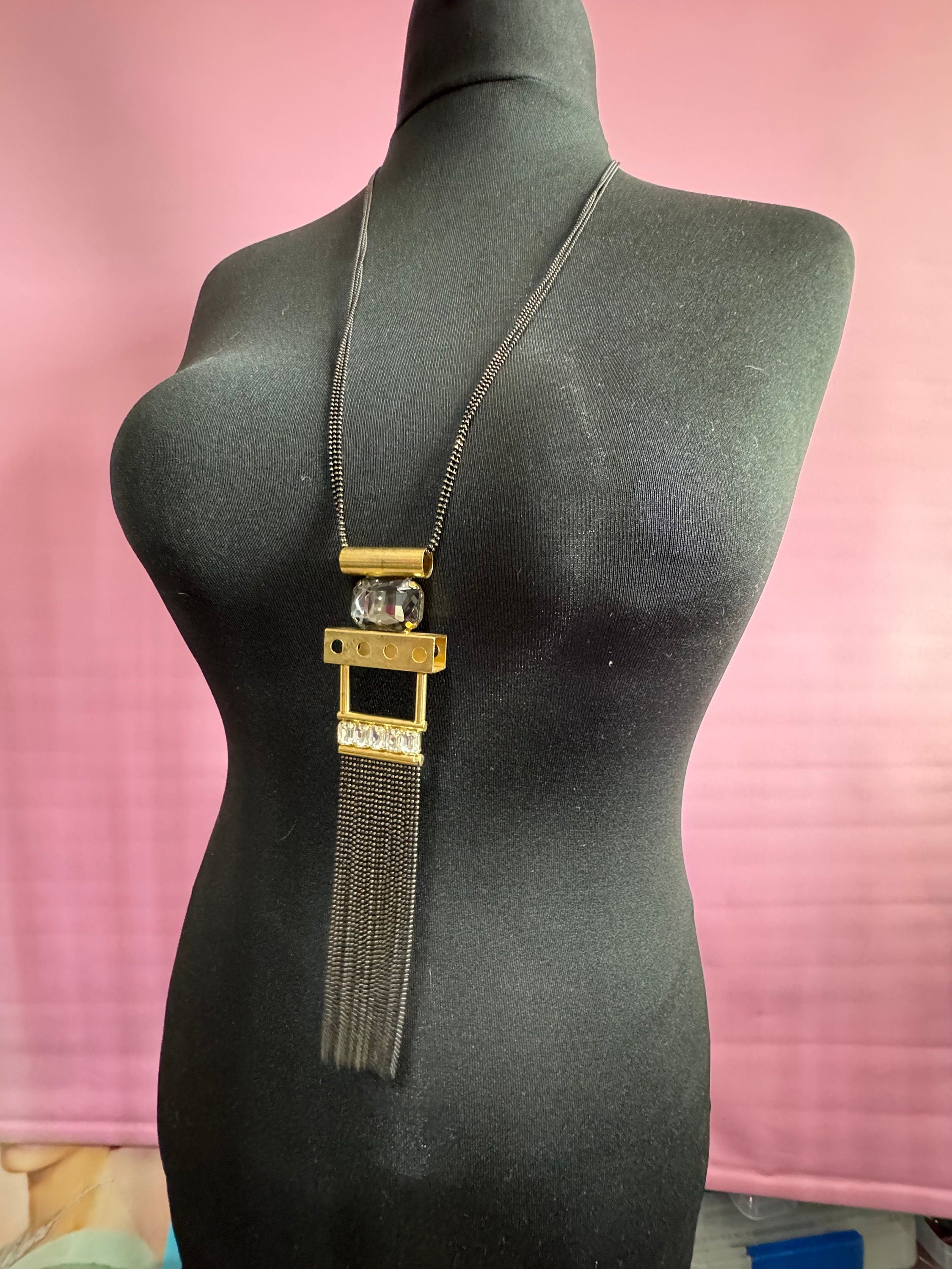 Signed Karine Sultan designer black and gold long medallion pendant tassel drop necklace couture