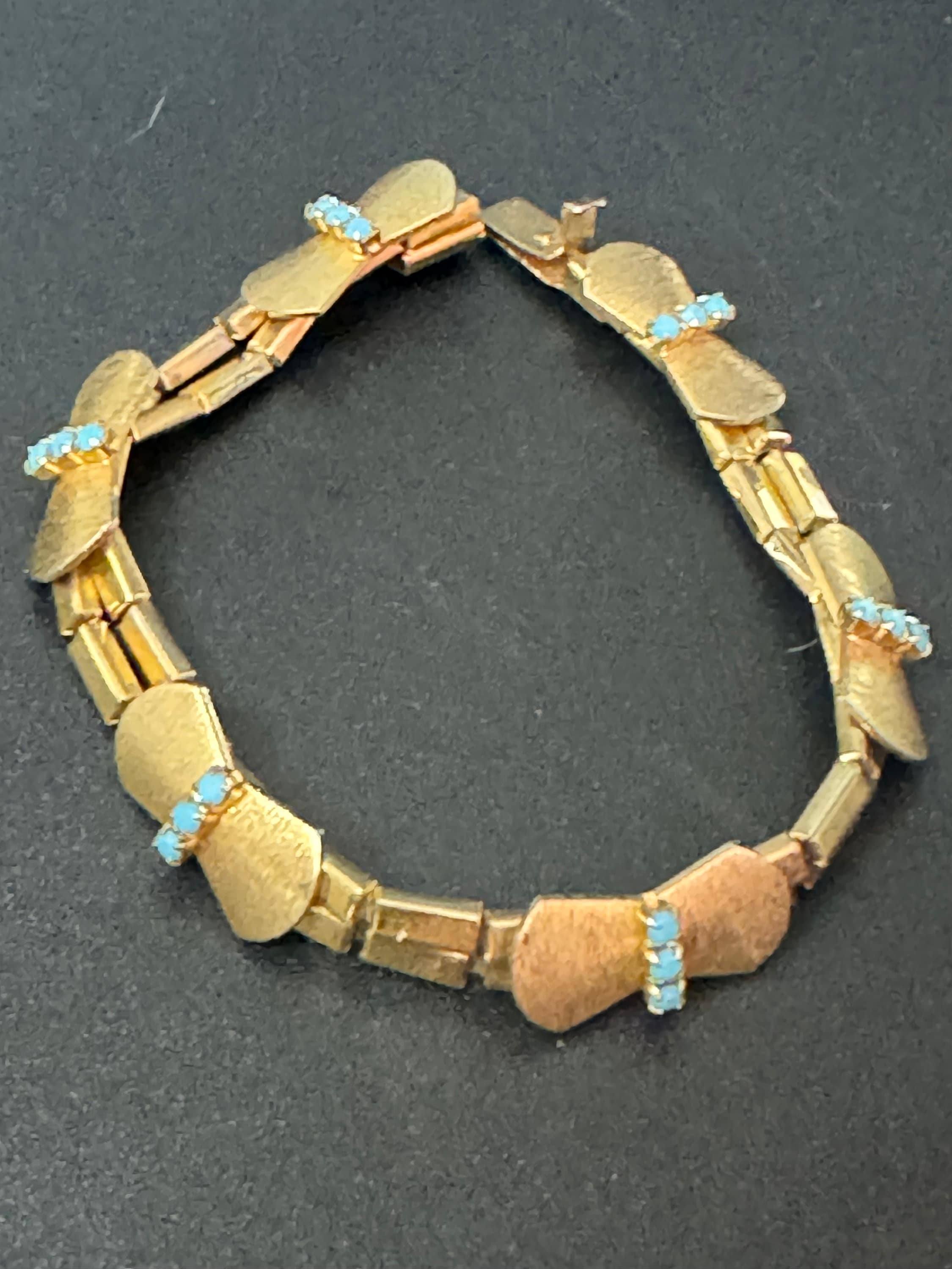 Vintage articulated flat link mesh gold tone bracelet with turquoise blue paste