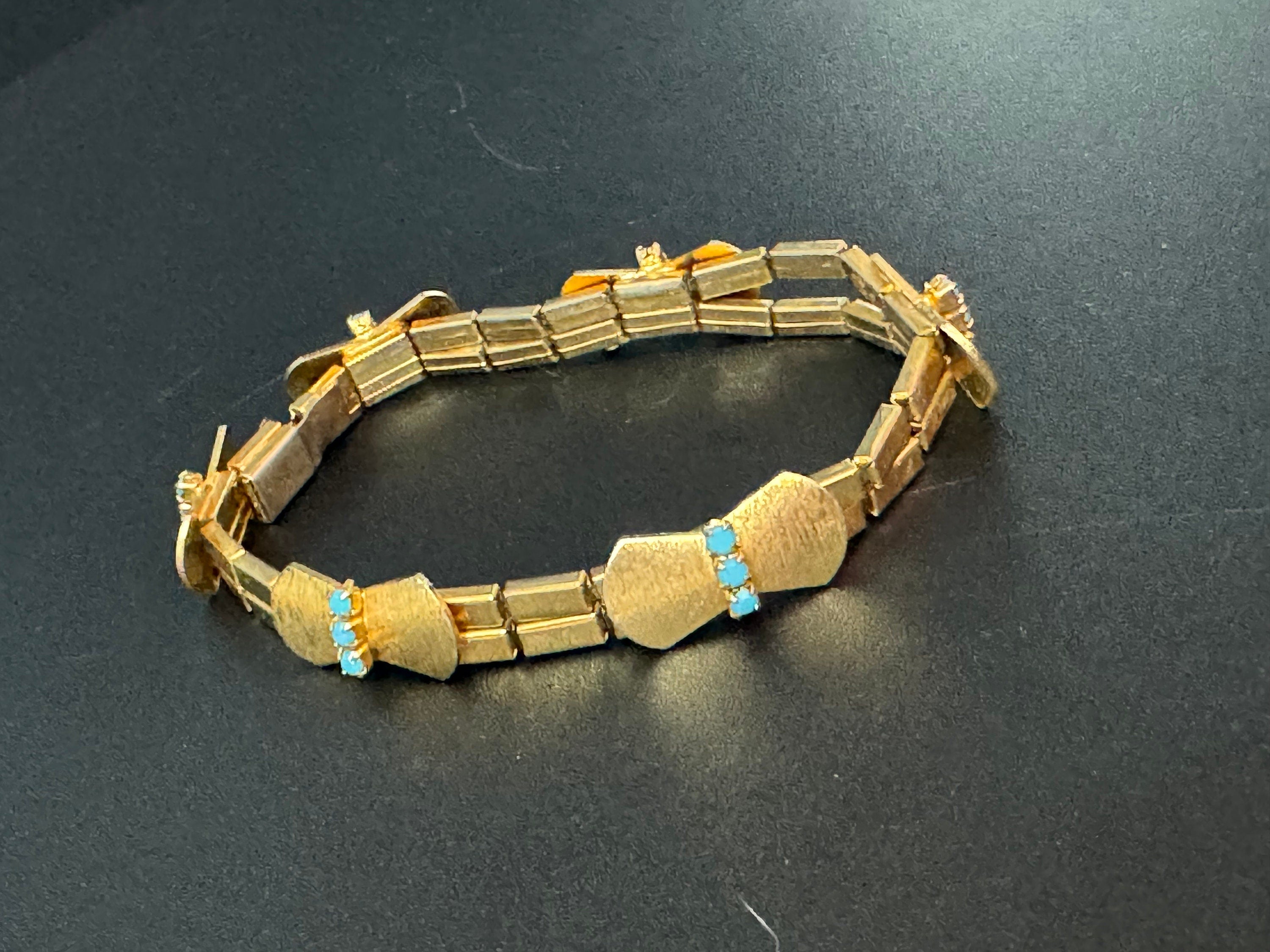 Vintage articulated flat link mesh gold tone bracelet with turquoise blue paste