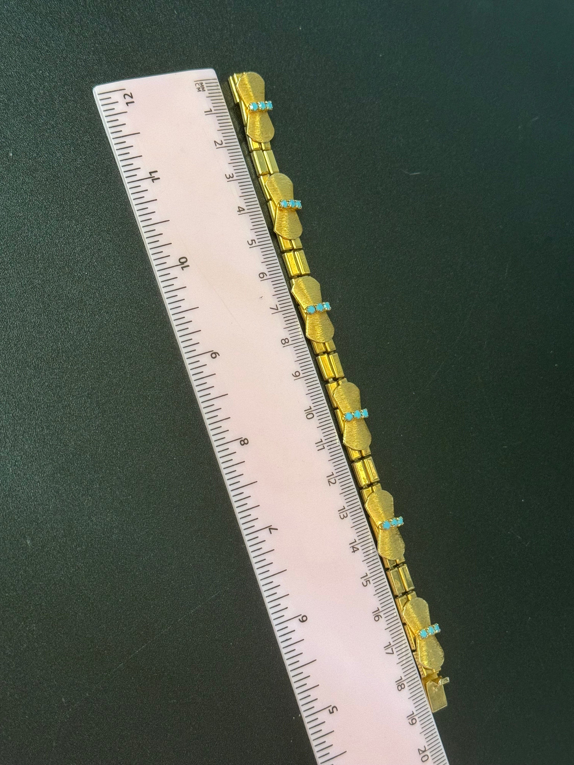 Vintage articulated flat link mesh gold tone bracelet with turquoise blue paste