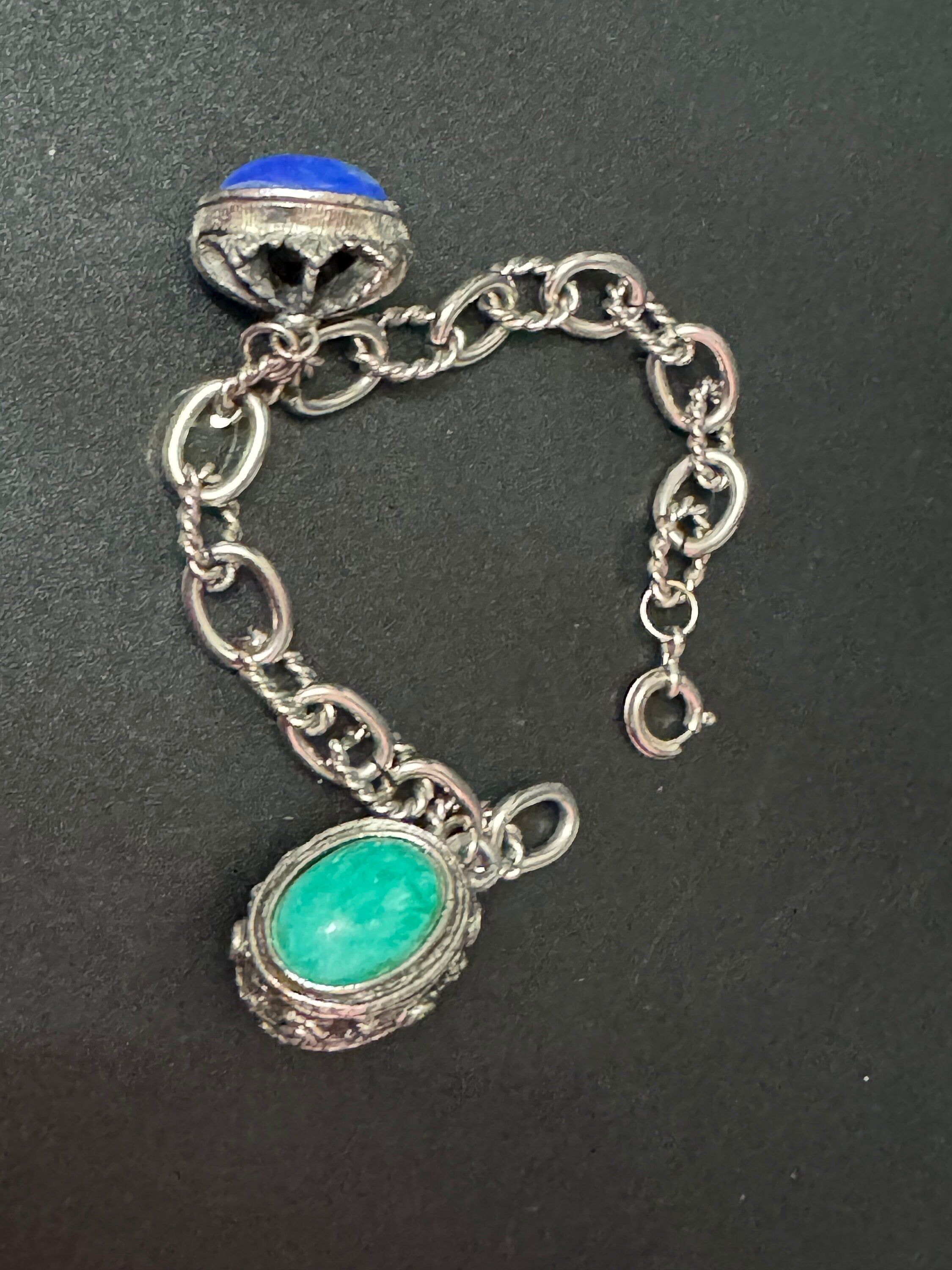 vintage 1970s silver tone chain link chunky charm bracelet with blue and green cabochons