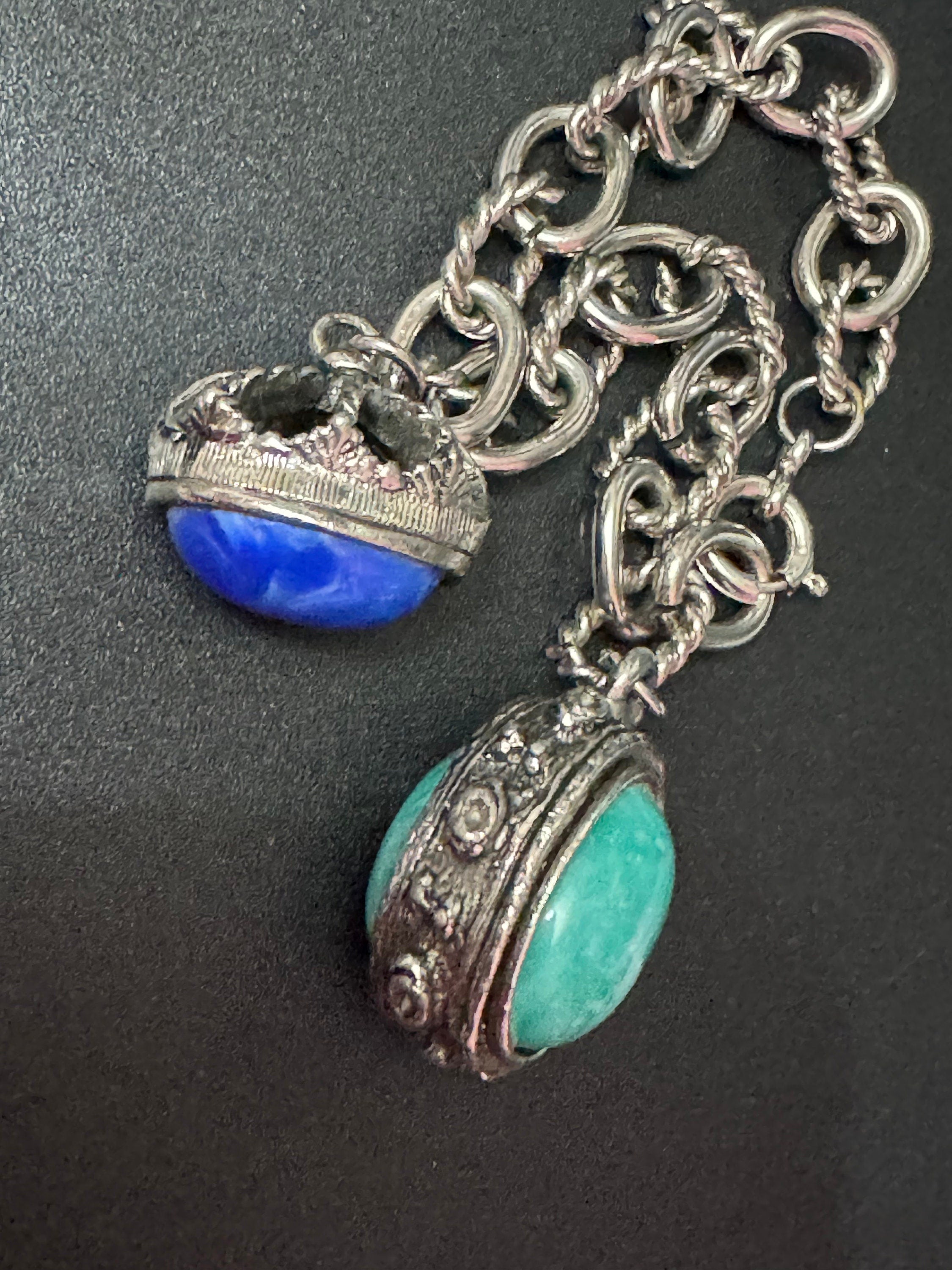 vintage 1970s silver tone chain link chunky charm bracelet with blue and green cabochons