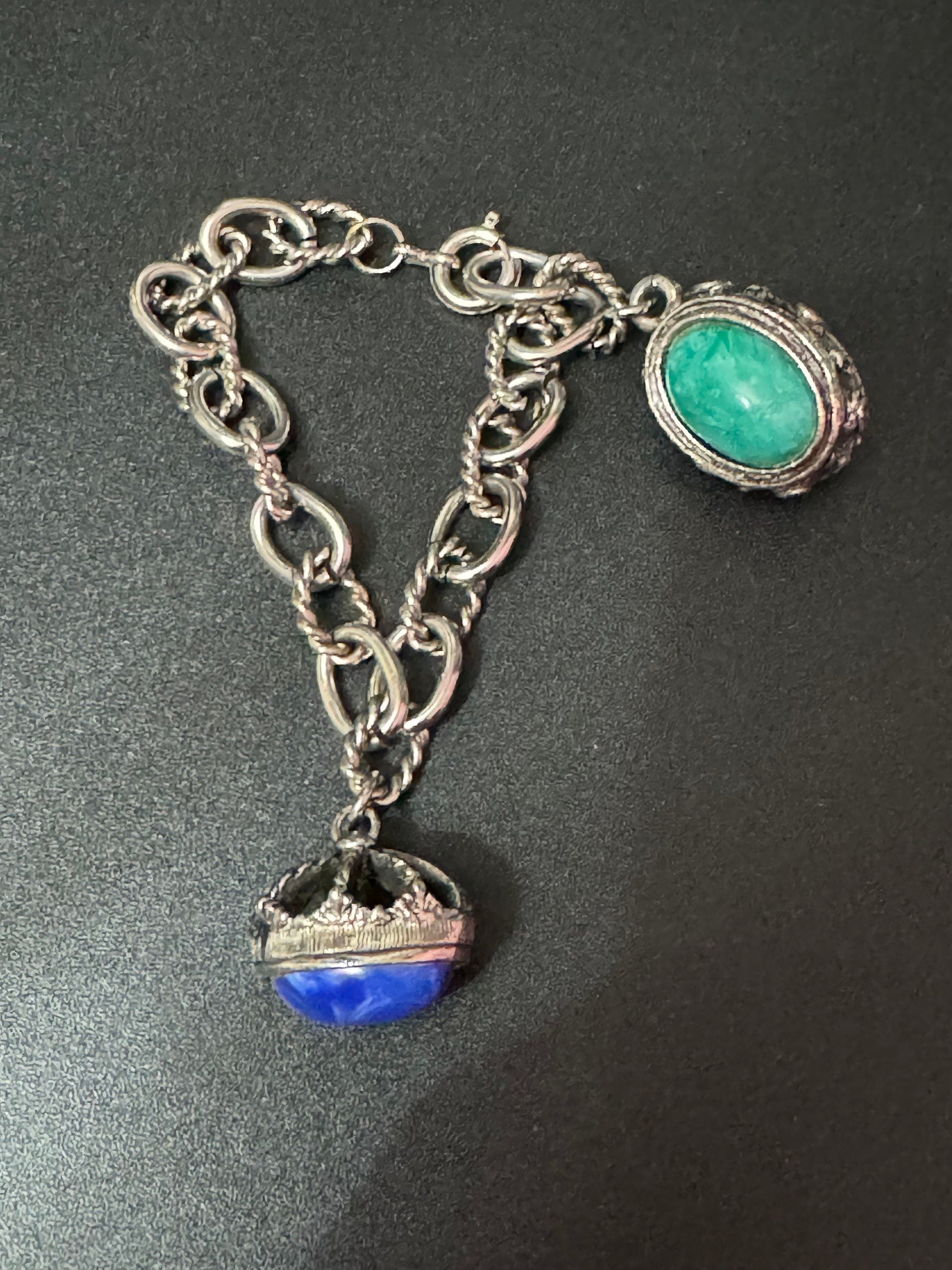 vintage 1970s silver tone chain link chunky charm bracelet with blue and green cabochons