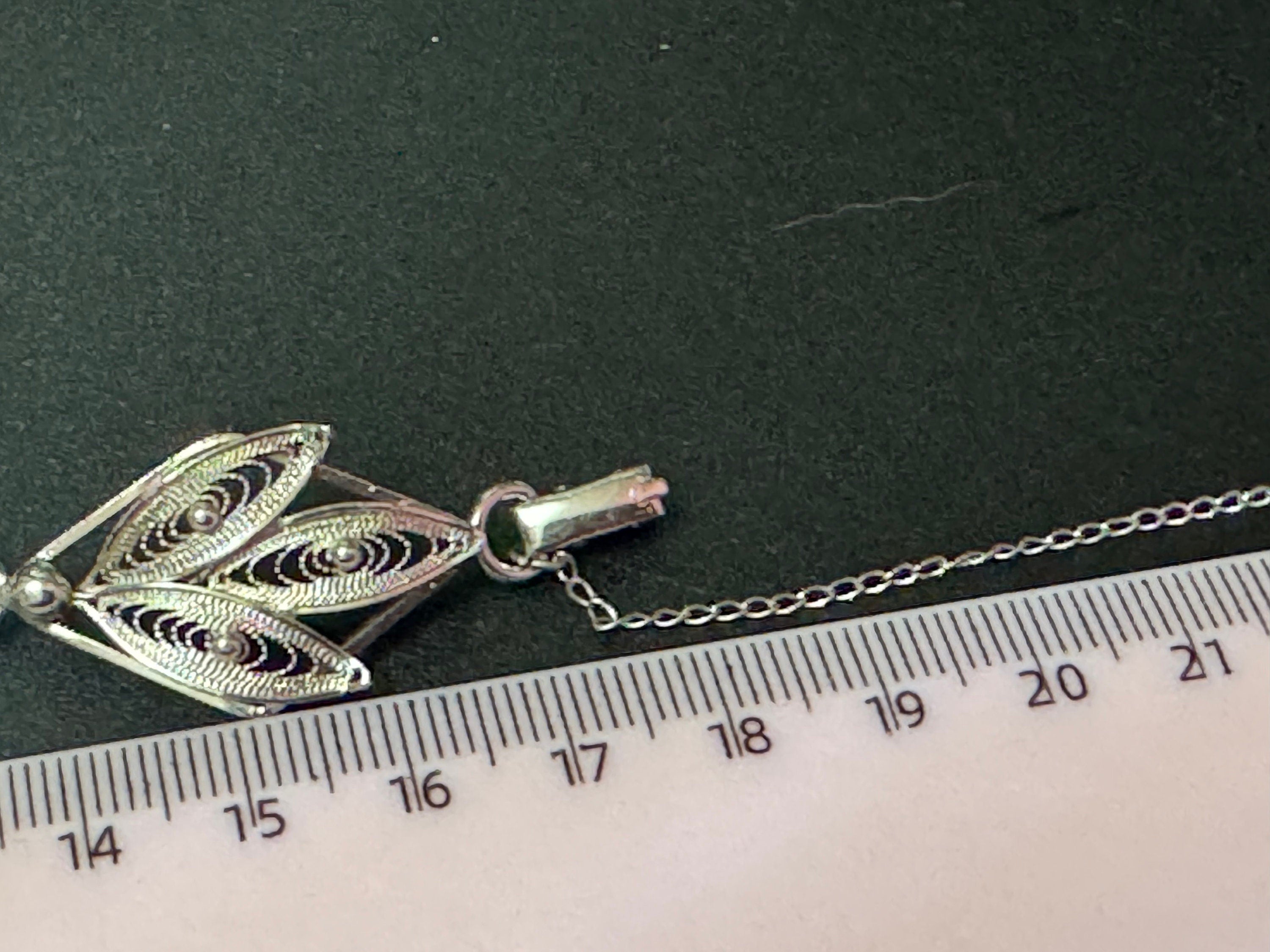 Silver tone fine filigree work panel link bracelet with safety chain