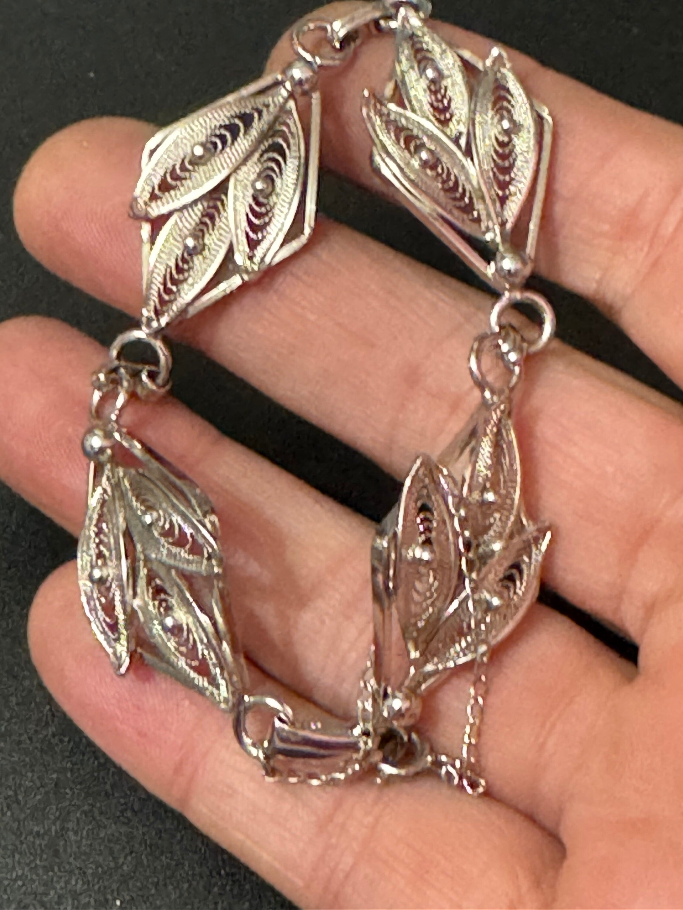 Silver tone fine filigree work panel link bracelet with safety chain