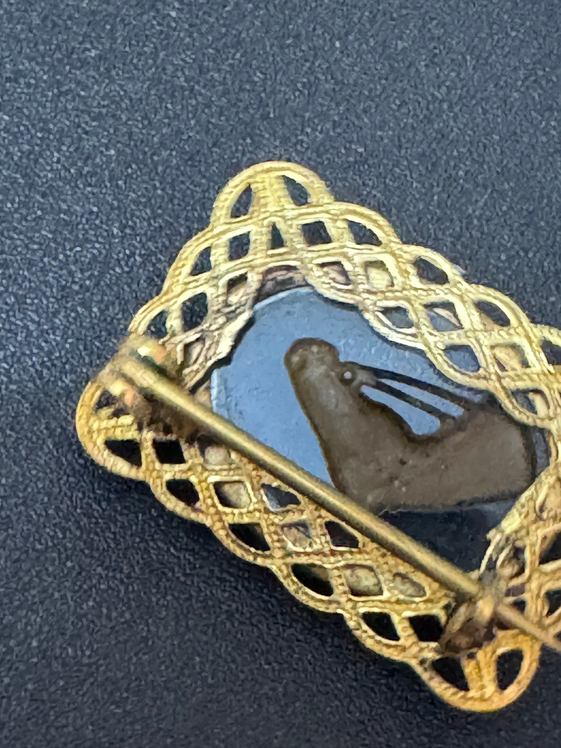 Antique small 2.5cm filigree reverse painted horse head brooch