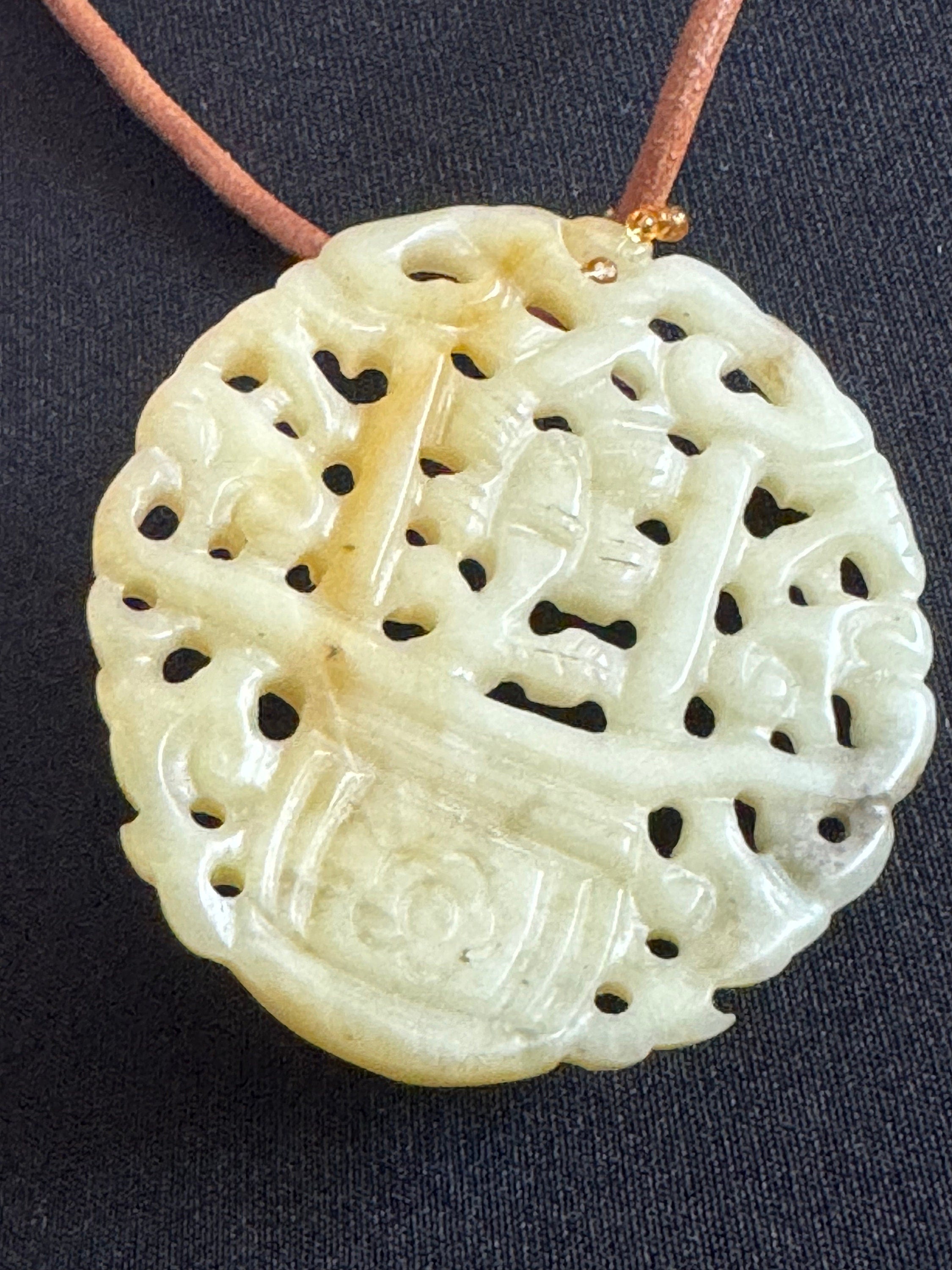 Signed Joan Rivers oversized carved light green brown jade Chinese pendant necklace on leather thong