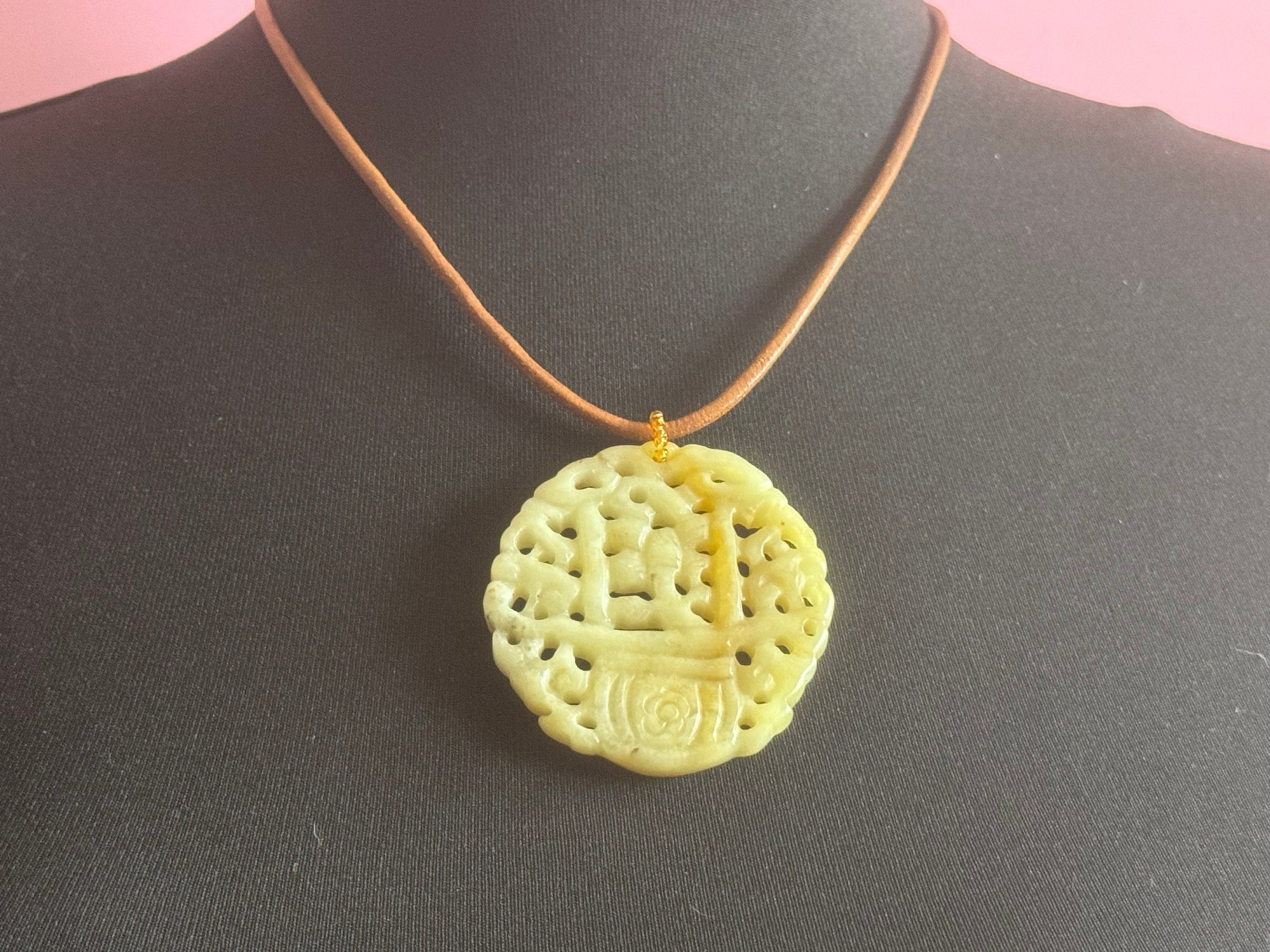 Signed Joan Rivers oversized carved light green brown jade Chinese pendant necklace on leather thong