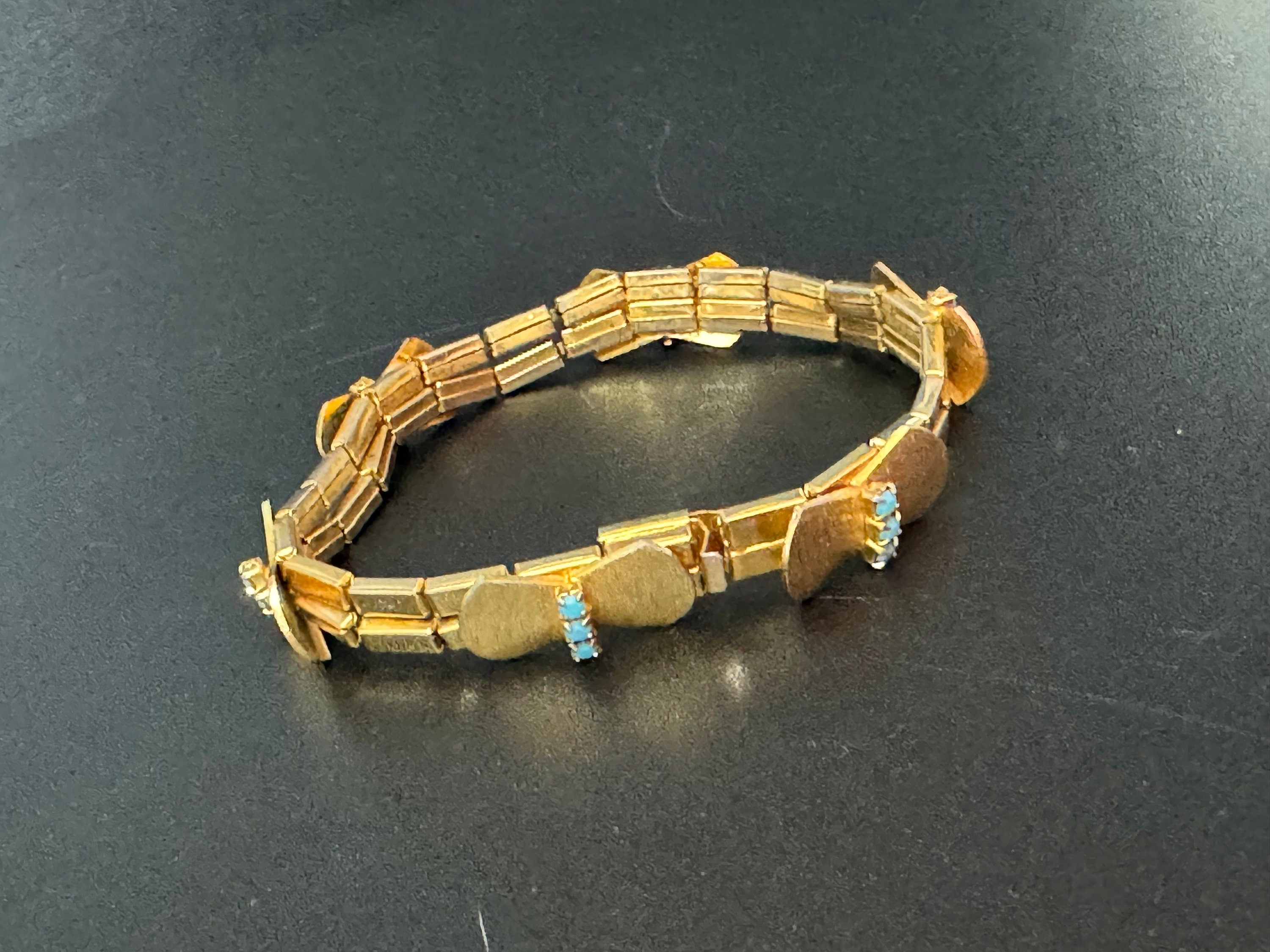 Vintage articulated flat link mesh gold tone bracelet with turquoise blue paste