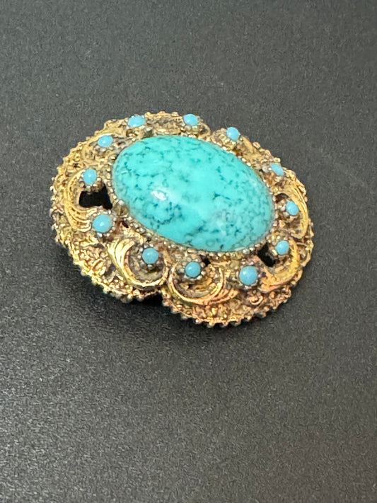 Vintage ornate gold tone turquoise oval cabochon brooch