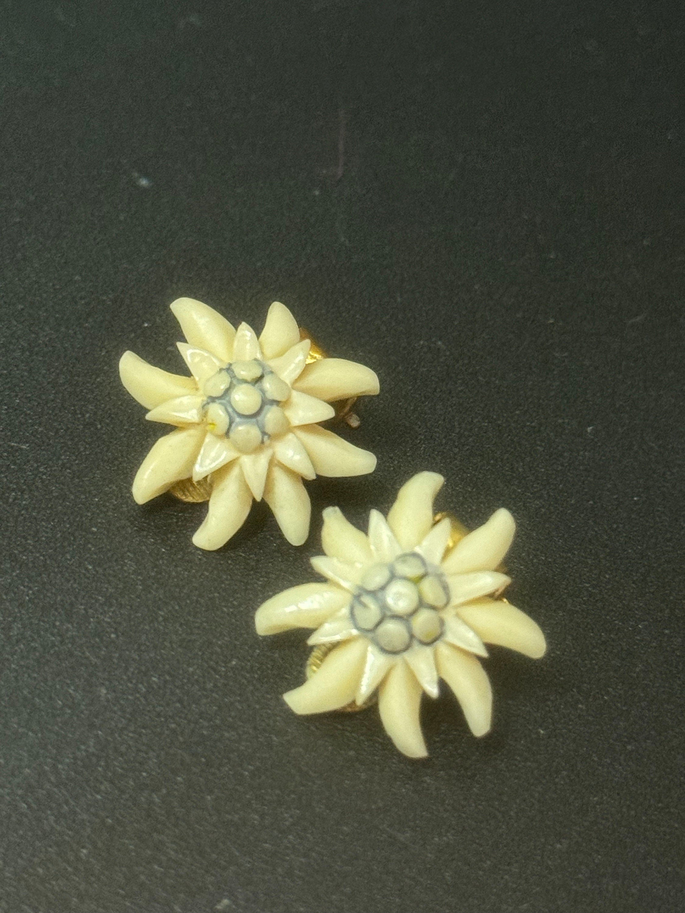 Antique edelweiss plastic earrings
