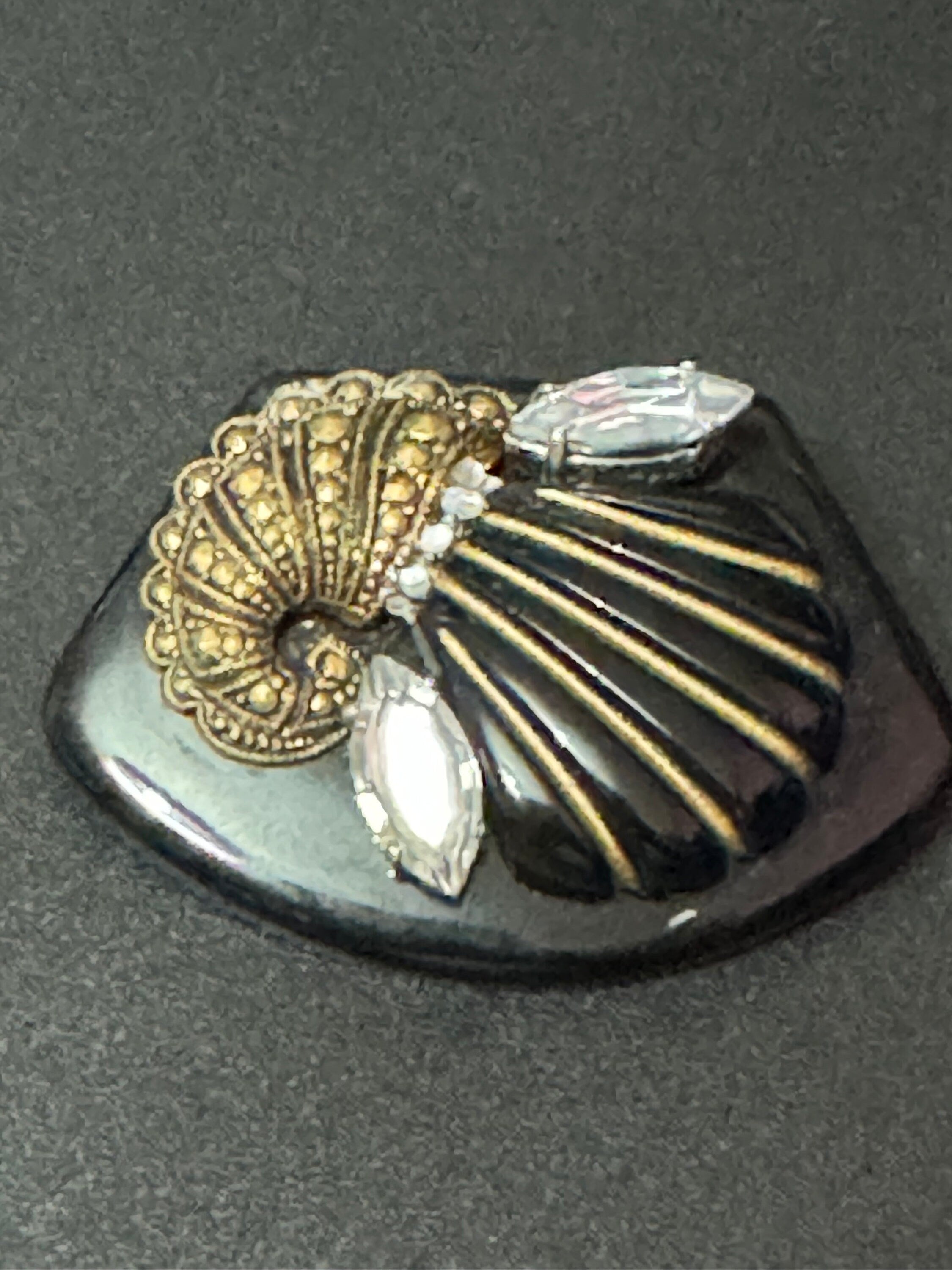 Vintage gold tone black early plastic rhinestone cornucopia brooch