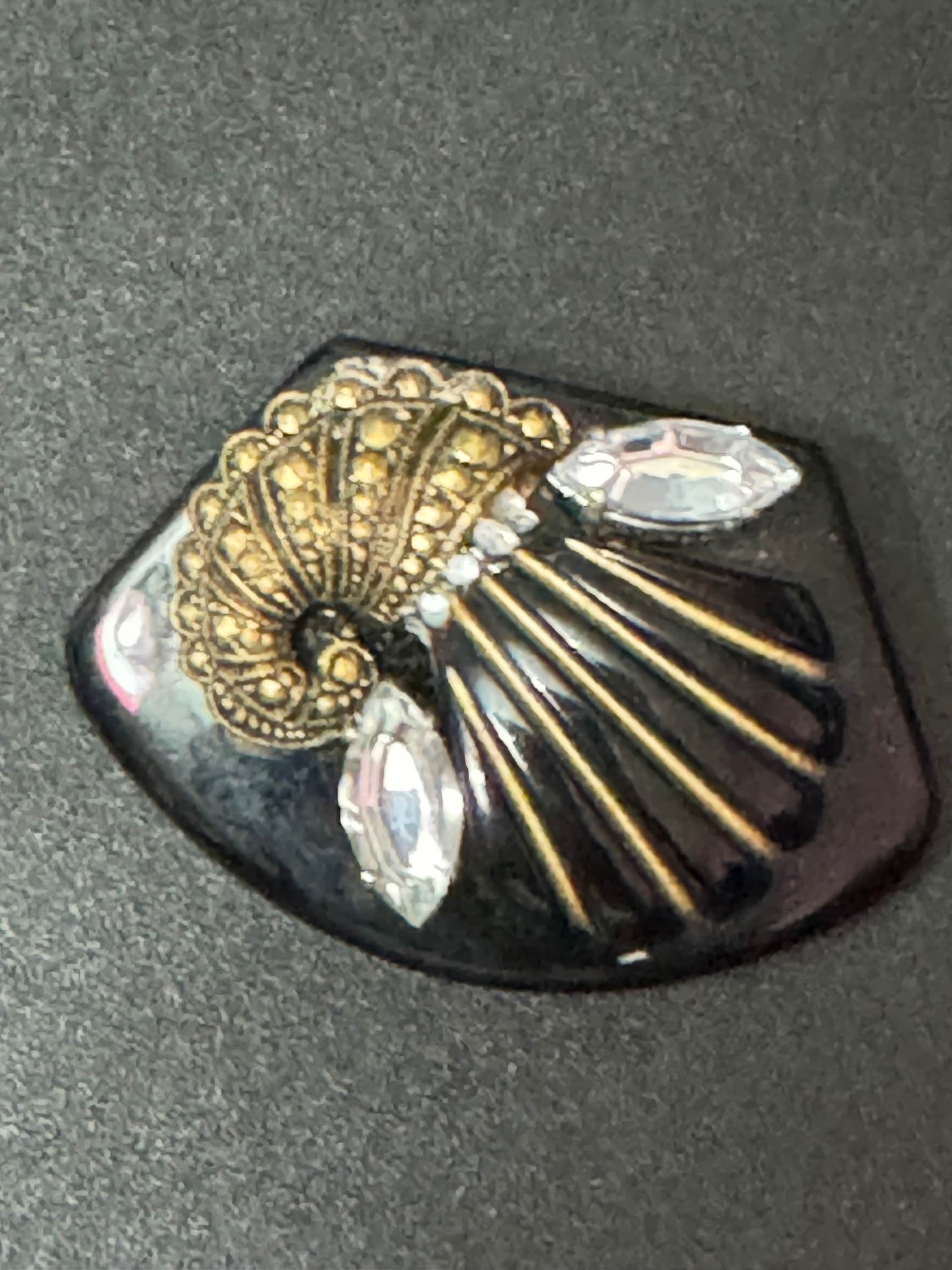 Vintage gold tone black early plastic rhinestone cornucopia brooch