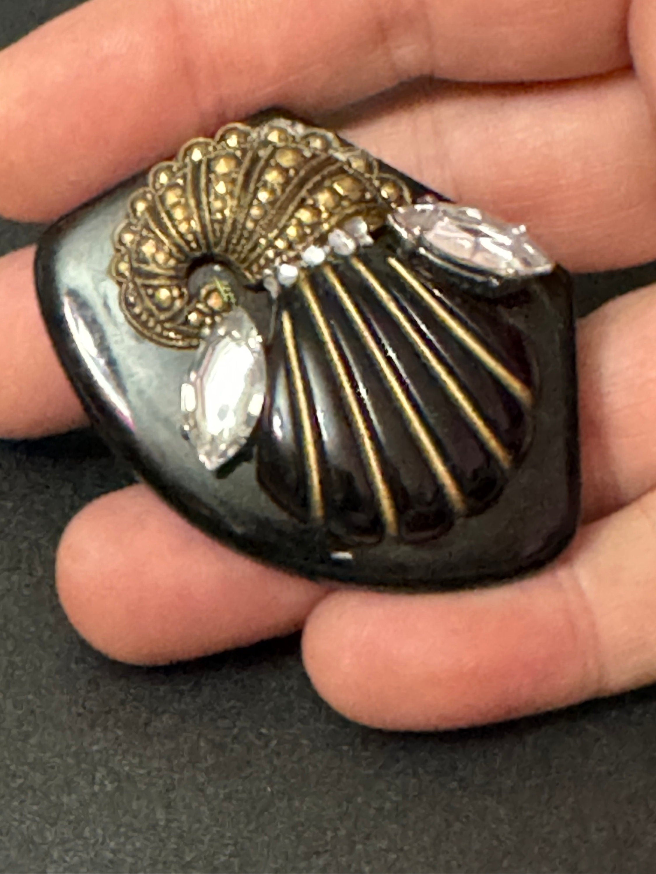 Vintage gold tone black early plastic rhinestone cornucopia brooch