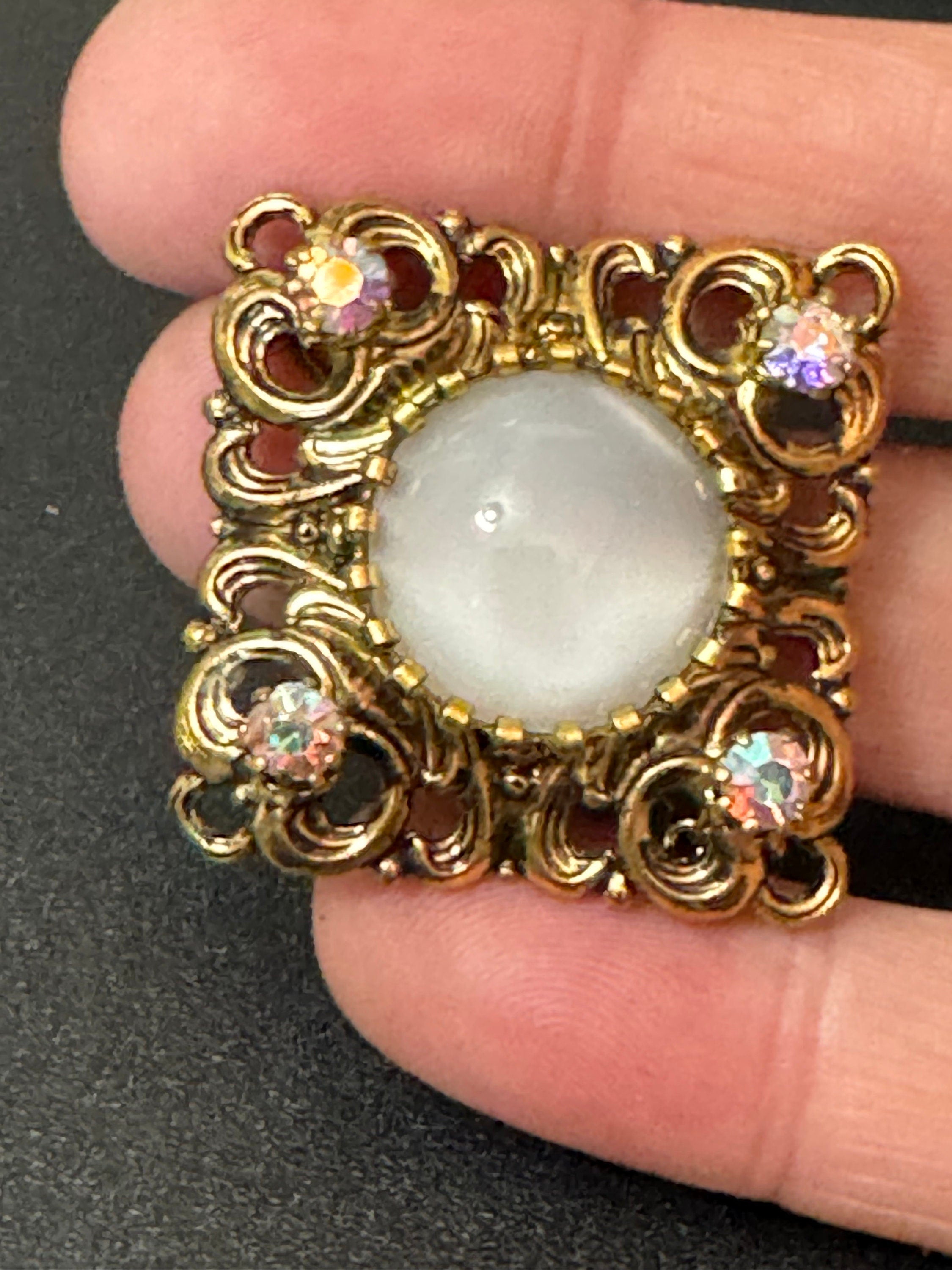 Antique Art Deco Czech brass gilt metal filigree brooch with white glass cabochon and AB rhinestones