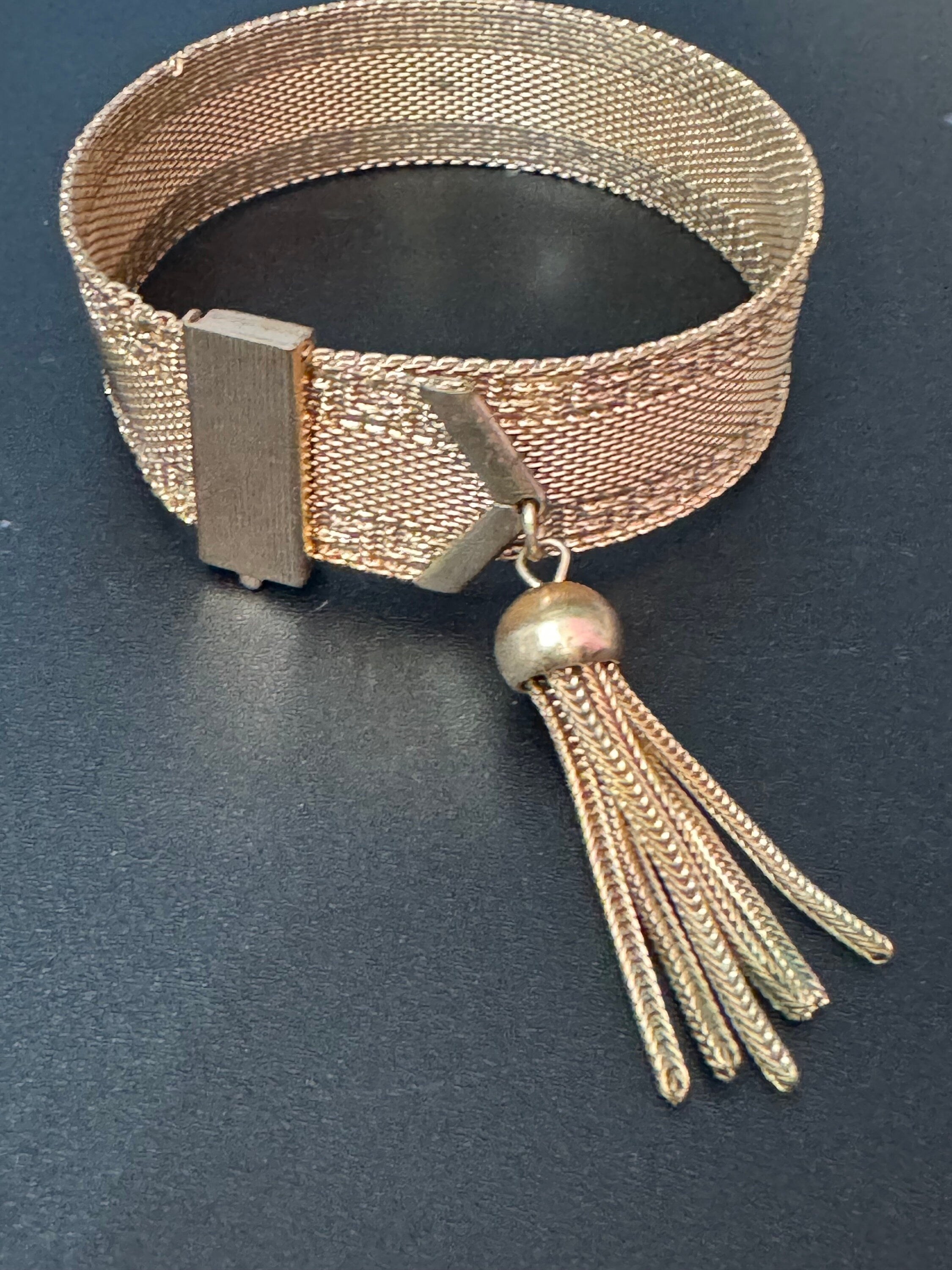 1970s Greek key design gold tone articulated flat 2cm wide tassel bracelet 19cm
