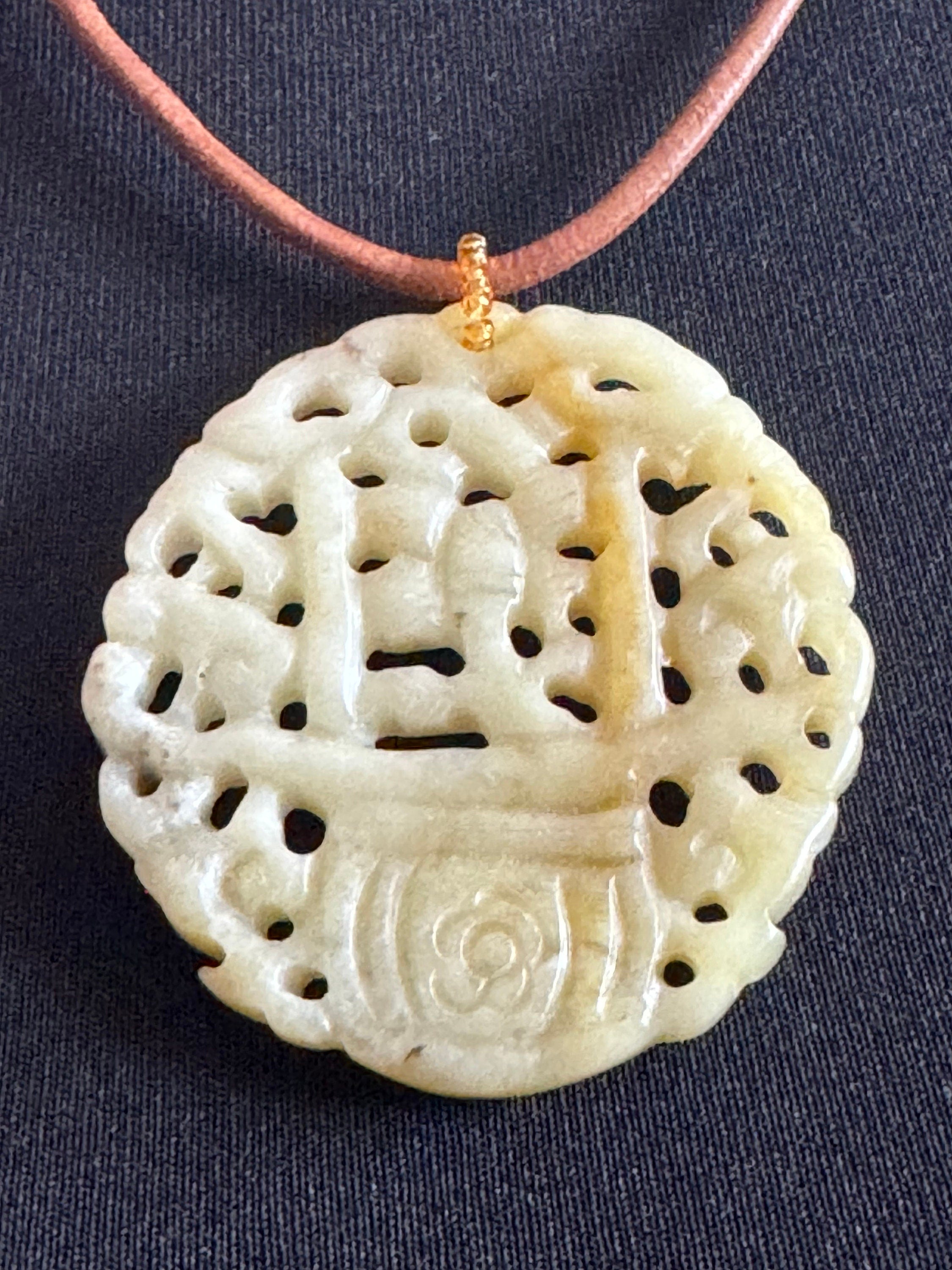 Signed Joan Rivers oversized carved light green brown jade Chinese pendant necklace on leather thong