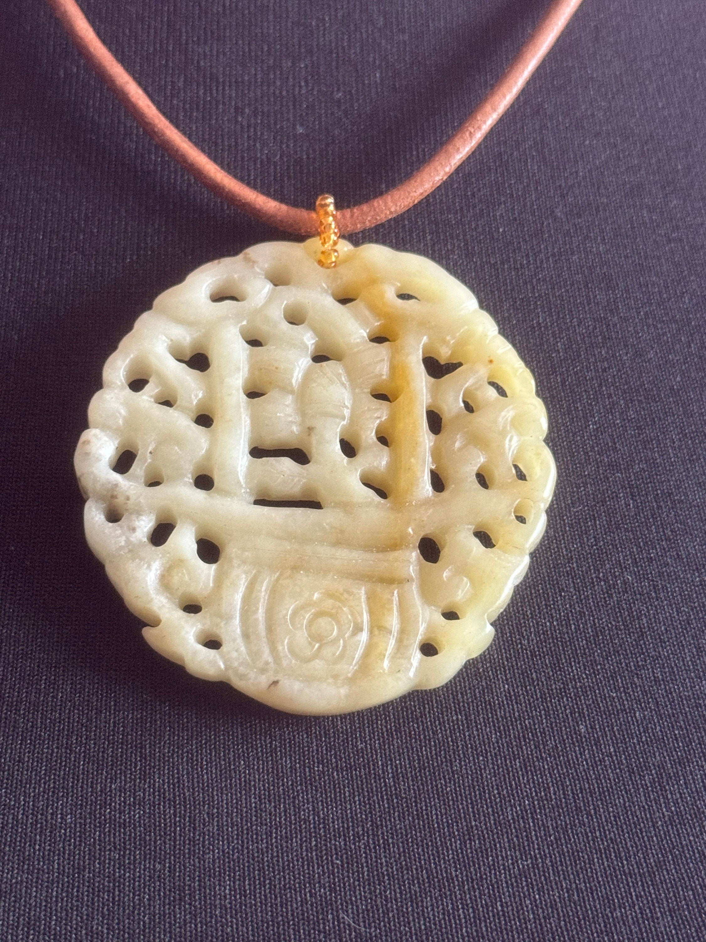Signed Joan Rivers oversized carved light green brown jade Chinese pendant necklace on leather thong