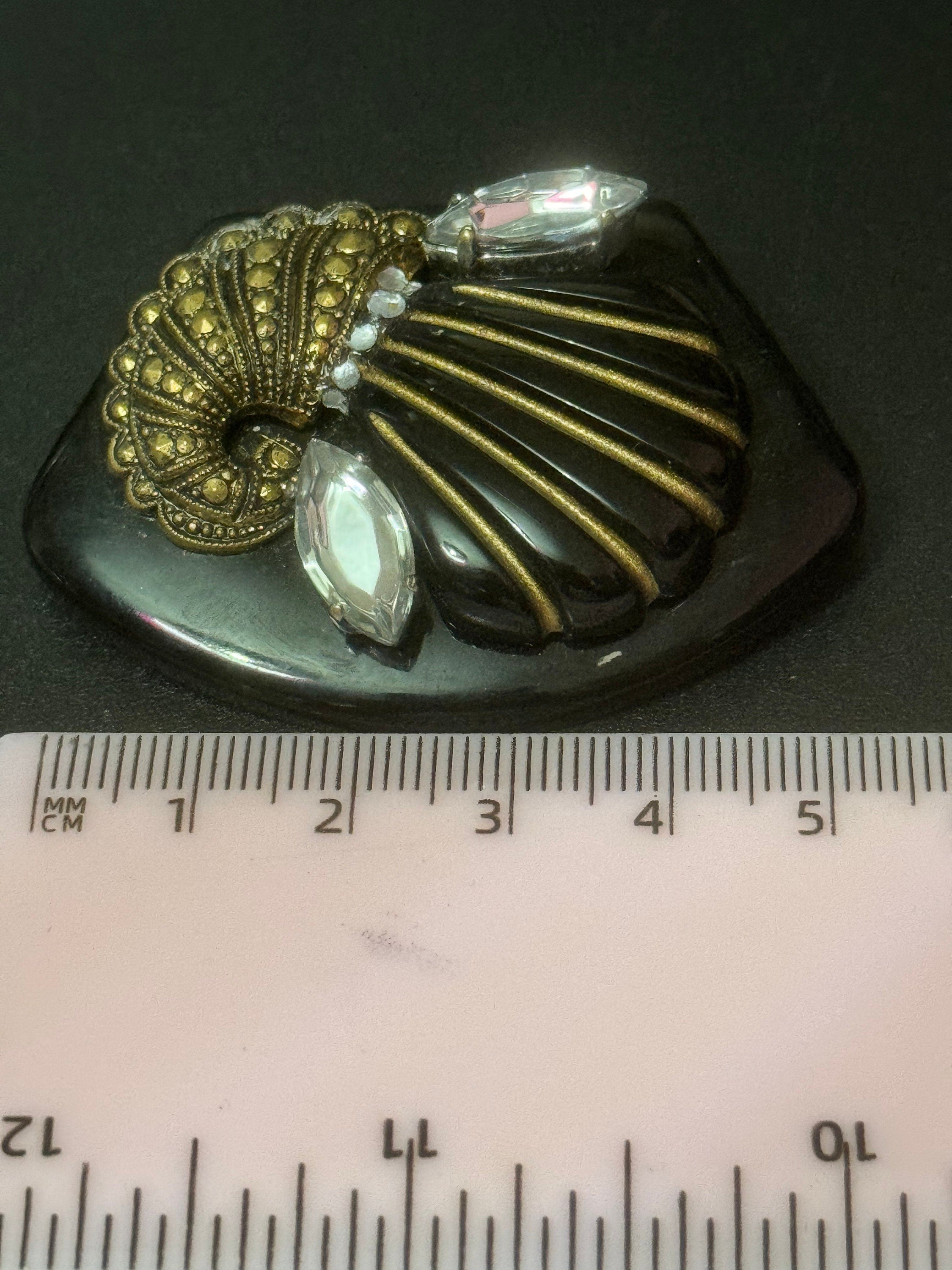 Vintage gold tone black early plastic rhinestone cornucopia brooch